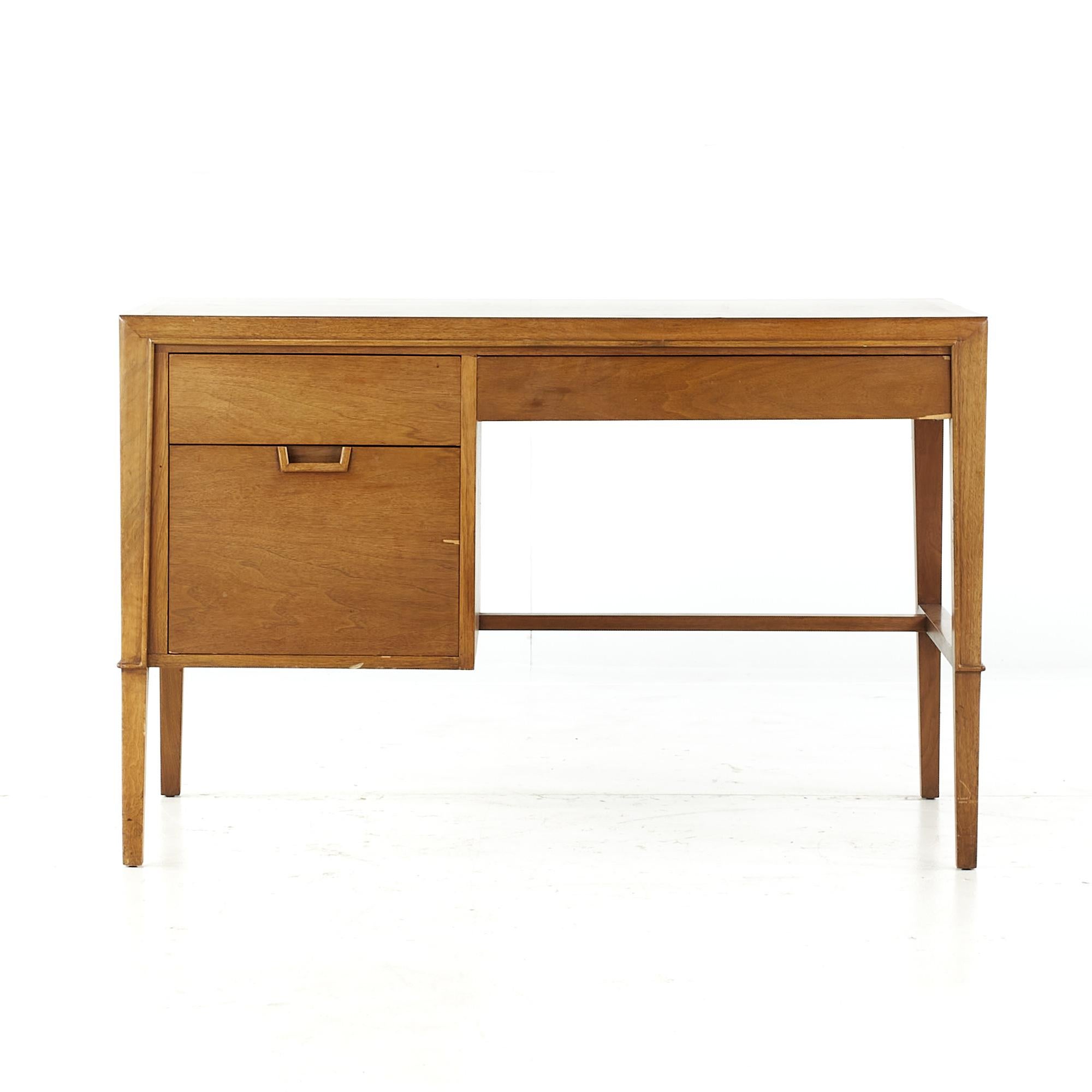 Mount Airy Janus mid century walnut desk

This desk measures: 46 wide x 24 deep x 29.5 high, with a chair clearance of 24.5 inches

All pieces of furniture can be had in what we call restored vintage condition. That means the piece is restored