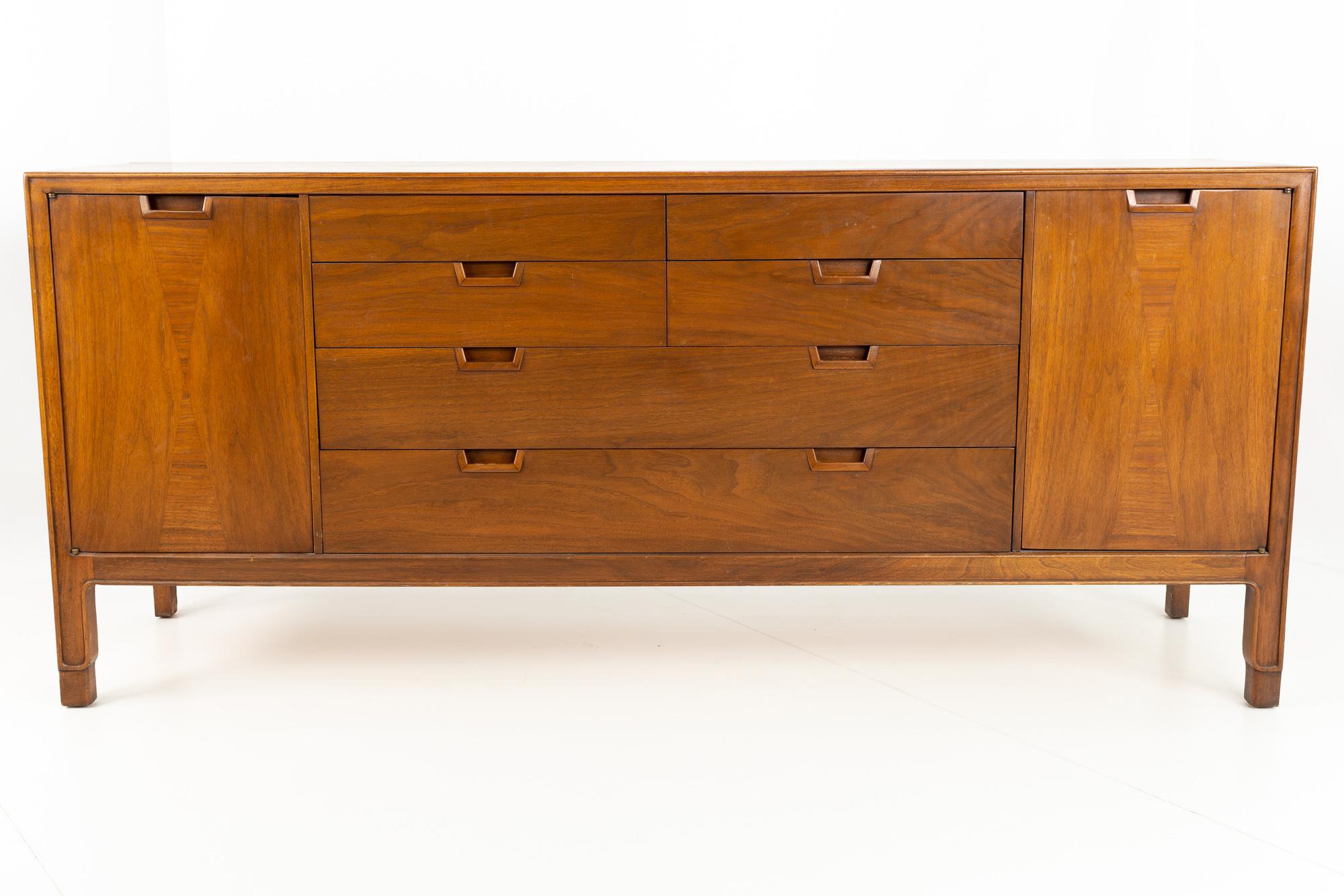 Mount Airy Mid Century Janus Collection 14-drawer walnut lowboy dresser.
This lowboy measures 71.75 wide x 19 deep x 31.5 inches high

All pieces of furniture can be had in what we call restored vintage condition. That means the piece is restored