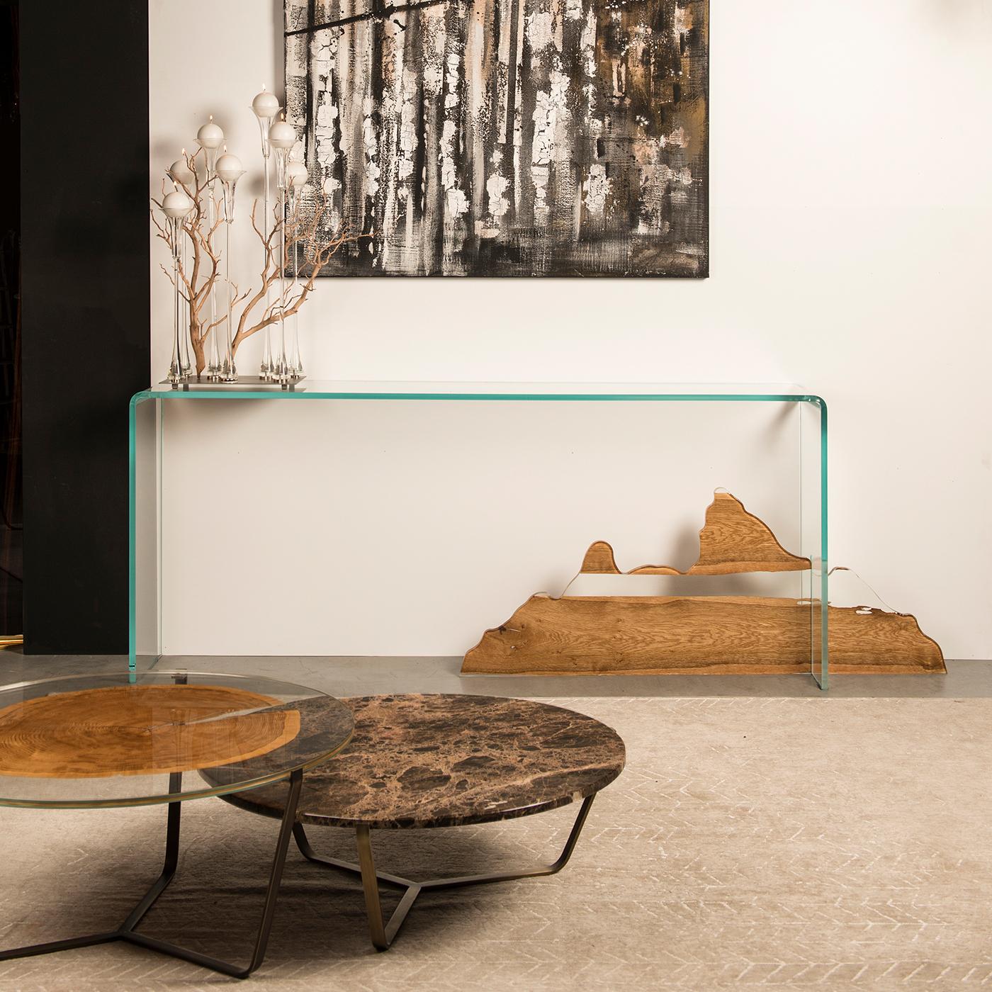 Inspired by the altar table, the place of worship in Chinese homes or Buddhist temples, this minimalist console designed by Lea Chen symbolizes the harmonious balance of forms and materials. Crafted of glass by Venetian artisans, one leg of the