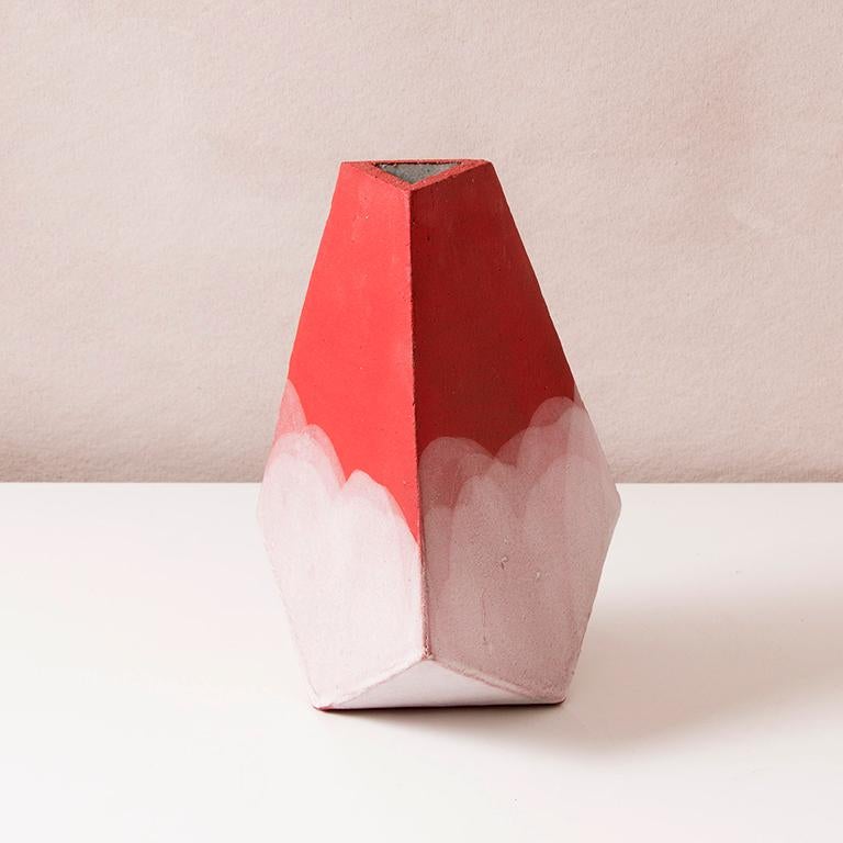 This hand-built geometric ceramic 'Mountain' vase by John Sheppard is made from an off-white stoneware, formed into a dramatic pyramid shape, and featuring a bright red matte underglaze finish accented by hand-poured matte white glaze. The