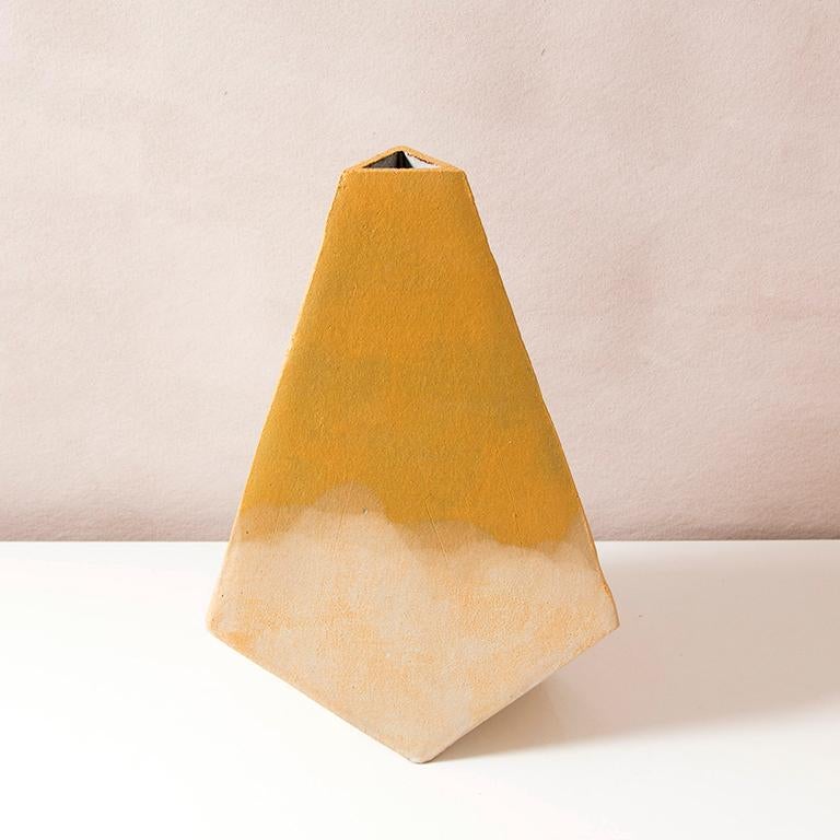 This set of hand-built geometric ceramic 'Mountain' vases by John Sheppard are made from an off-white stoneware. Each is formed into a dramatic pyramid shape, and featuring bright matte underglaze finishes accented by hand-poured matte white glaze.