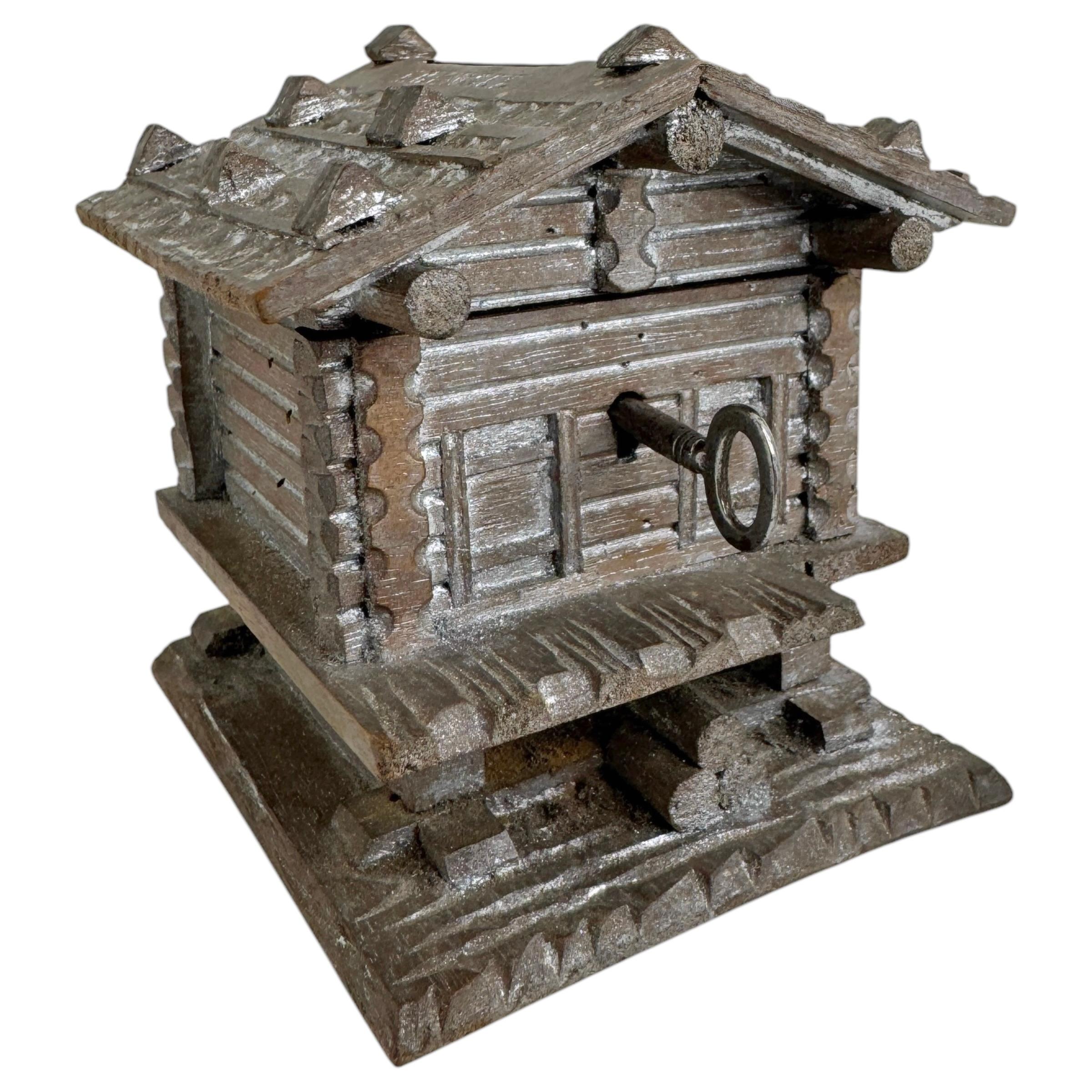 Gorgeous vintage money bank. A beautiful decorative item in hand carved wood. Made in Austria, circa 1910s or older as a souvenir bank. Lock is in working condition.
The tradition of these in Austria made items go's back to the early 19th century