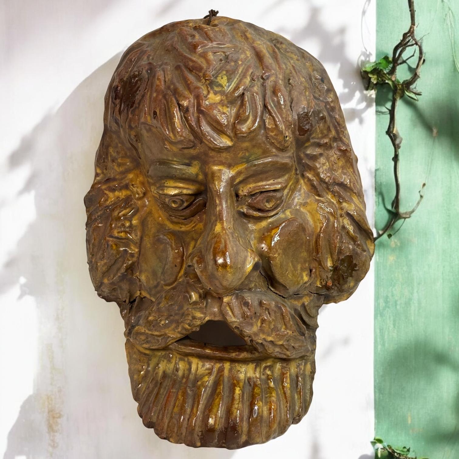 A beautiful vintage ceramic terracotta glazed wall mask of a male. It’s in the style of South Tyrollean or tuscany folk art. It would make a beautiful decoration on each wall. Made in the 1920s or older it displays the joy of a great era with a