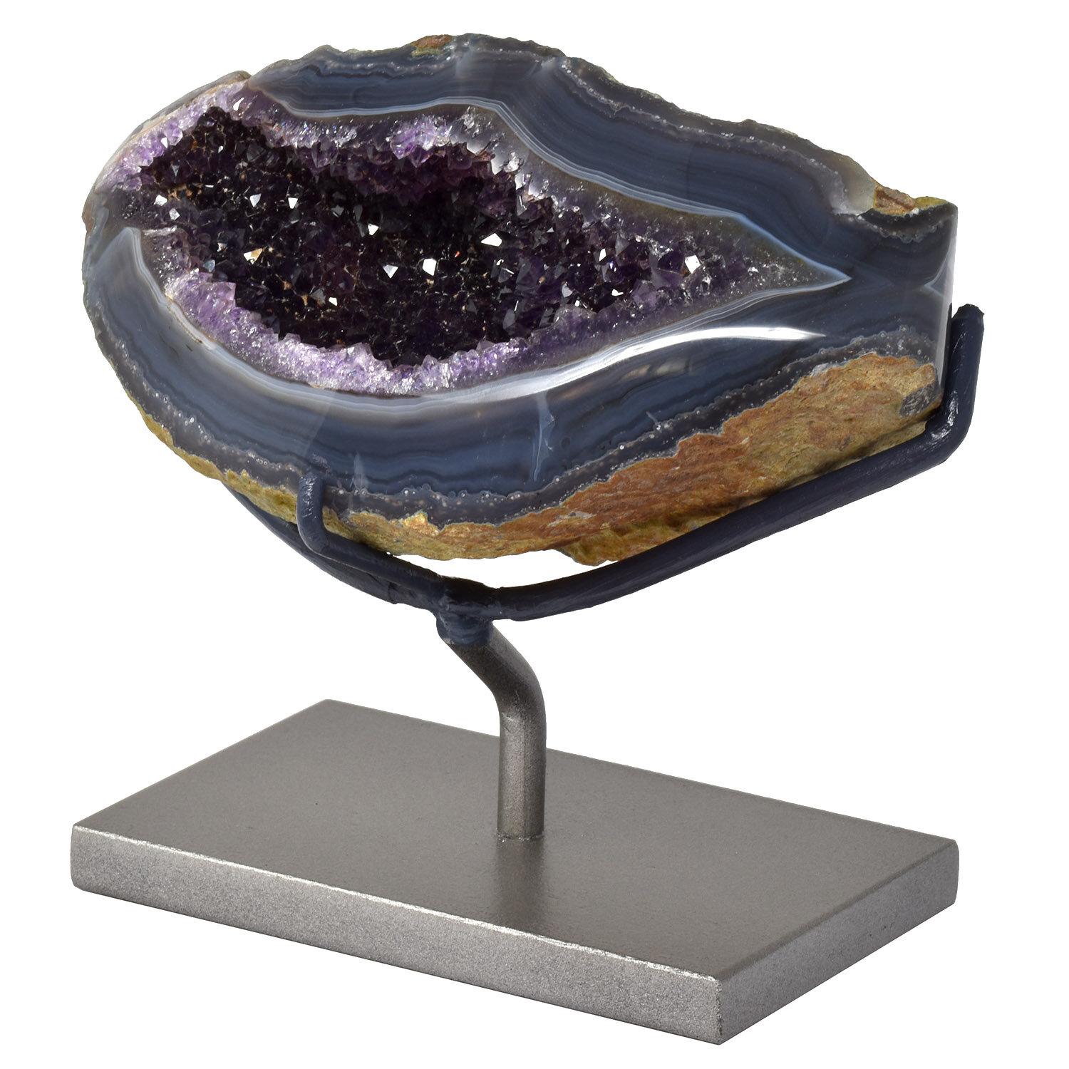 A cut and polished geode, in the form of a large smile
Dimensions: 3 H x 5 W x 3 D in. / 7.5 H x 12.5 W x 7.5 D cm
Height on custom satin nickel display stand 5 in. / 12.5 cm
One of a kind
Amethyst is the birthstone for February

The interior