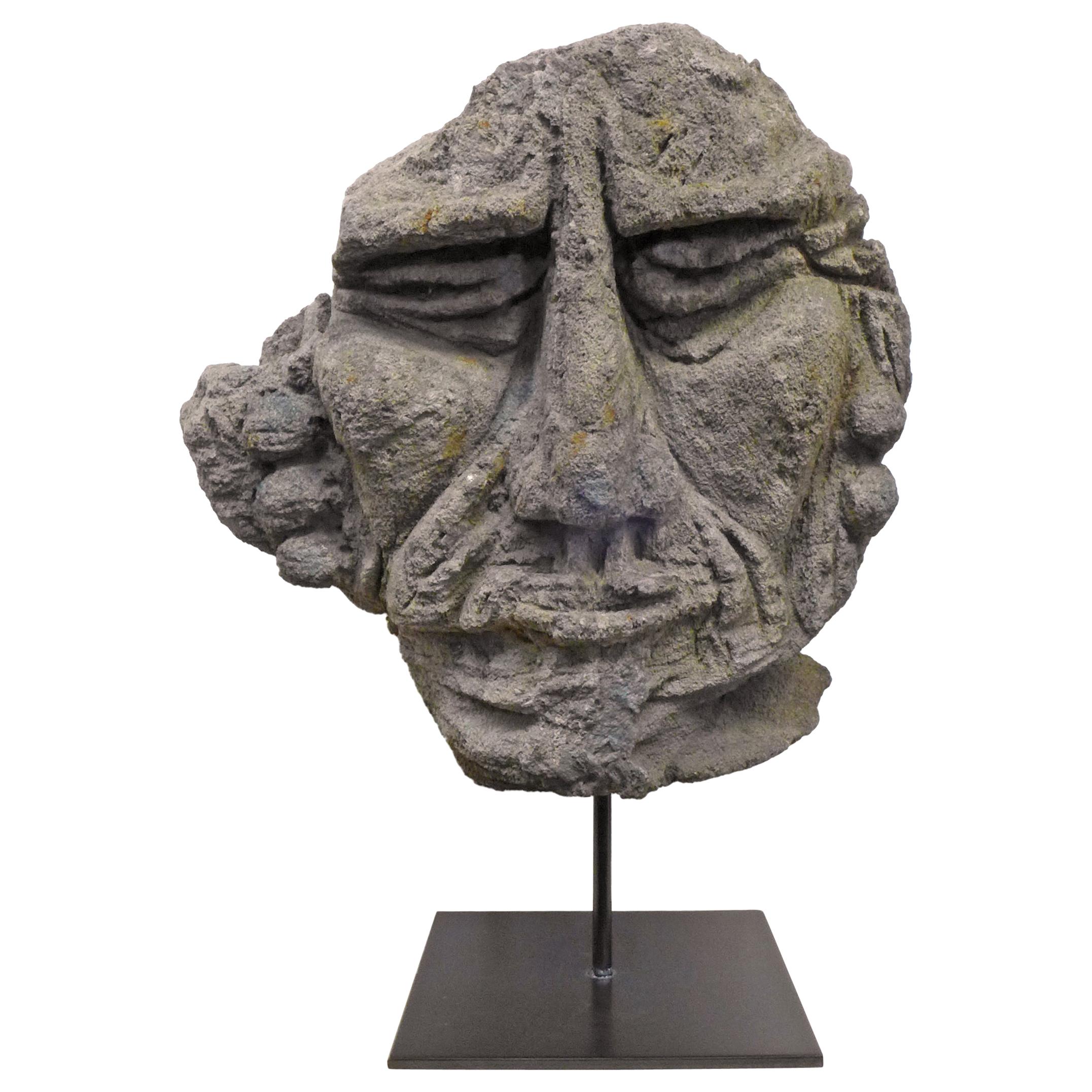 Mounted Carved Lava Stone Human Face Sculpture For Sale