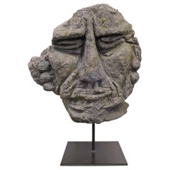 Mounted Carved Lava Stone Human Face Sculpture