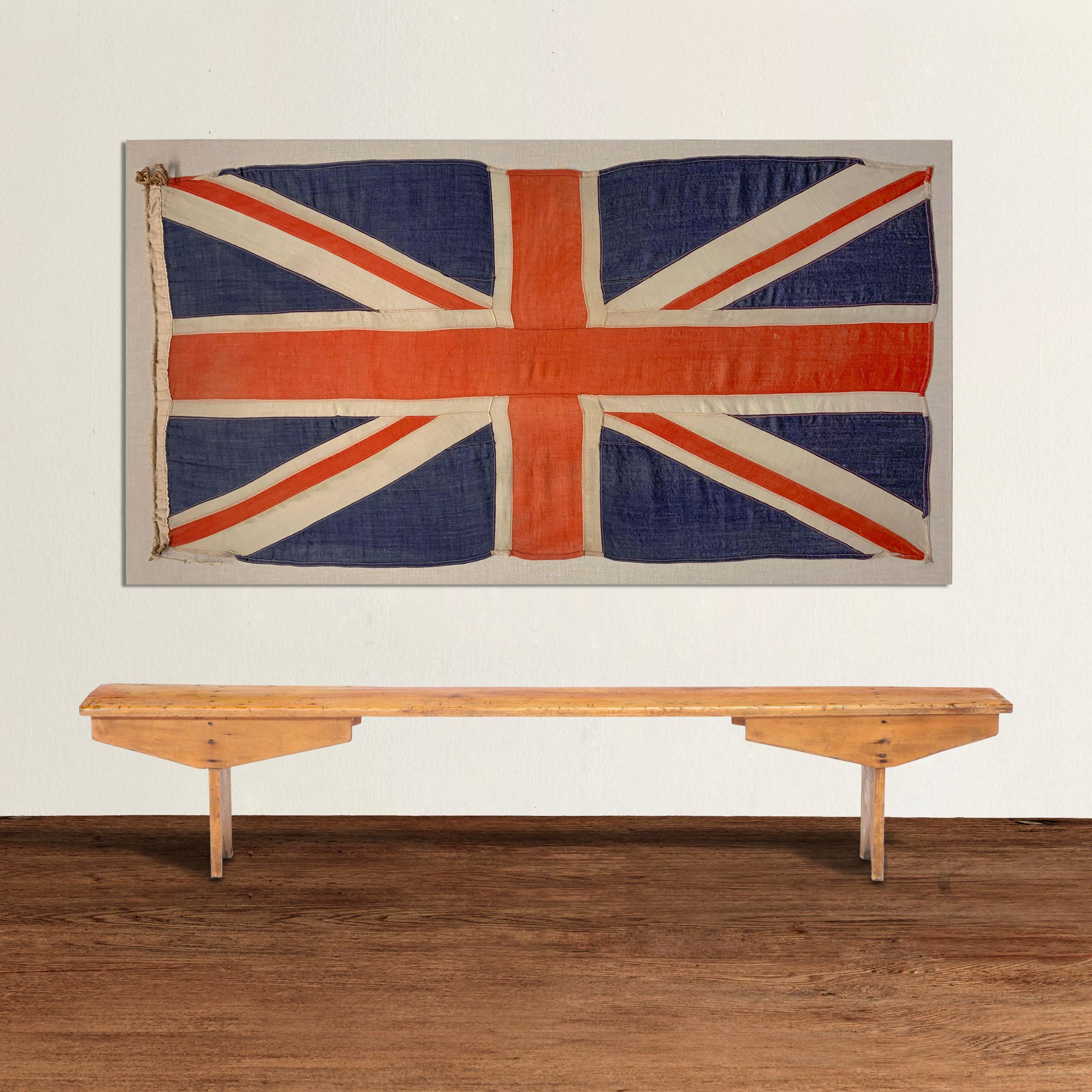 A large and loyal vintage British nautical Union Jack flag, woven of red, white, and blue linen, and handstitched onto a Belgian linen stretchers. Can hang vertically or horizontally.