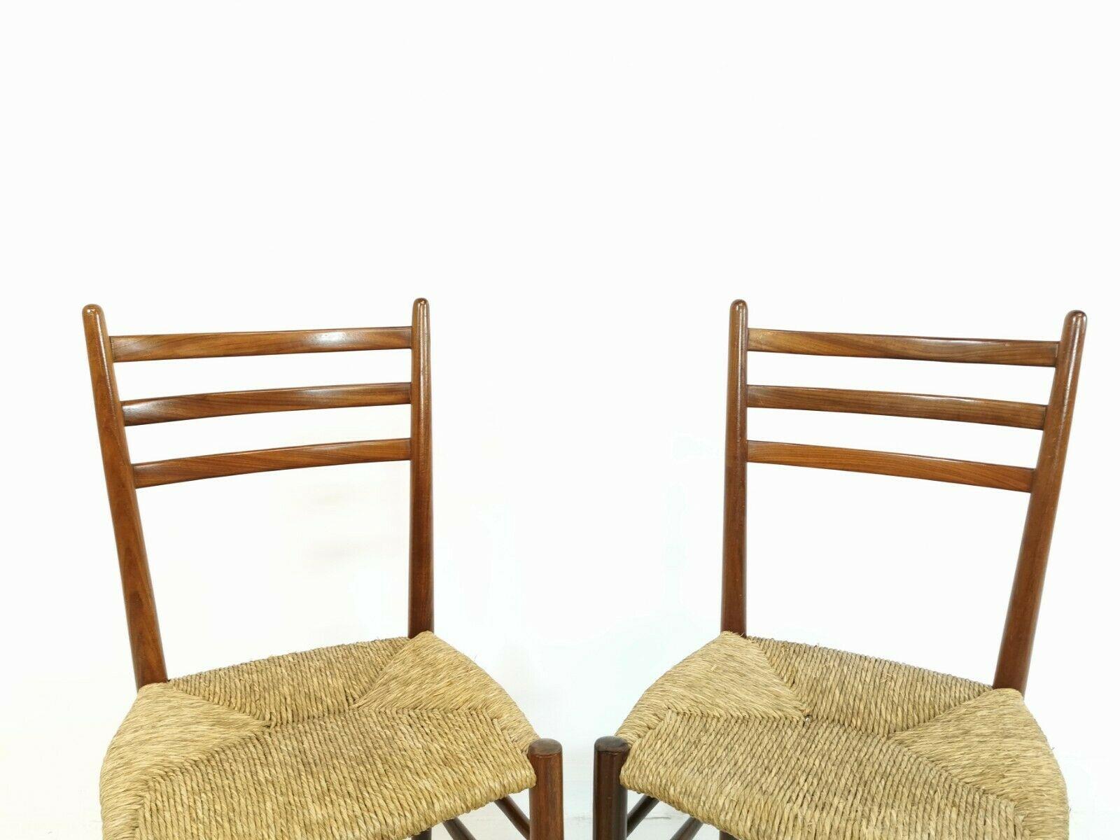 Made in Italy. Teak frames with rush seats. Dated to the 1950s-1960s. Price for the set.

Chairs bear a retailers label for 'Rooksmoor Mills' which used to be a high-quality furniture shop in Gloucestershire. 

Classic and stylish