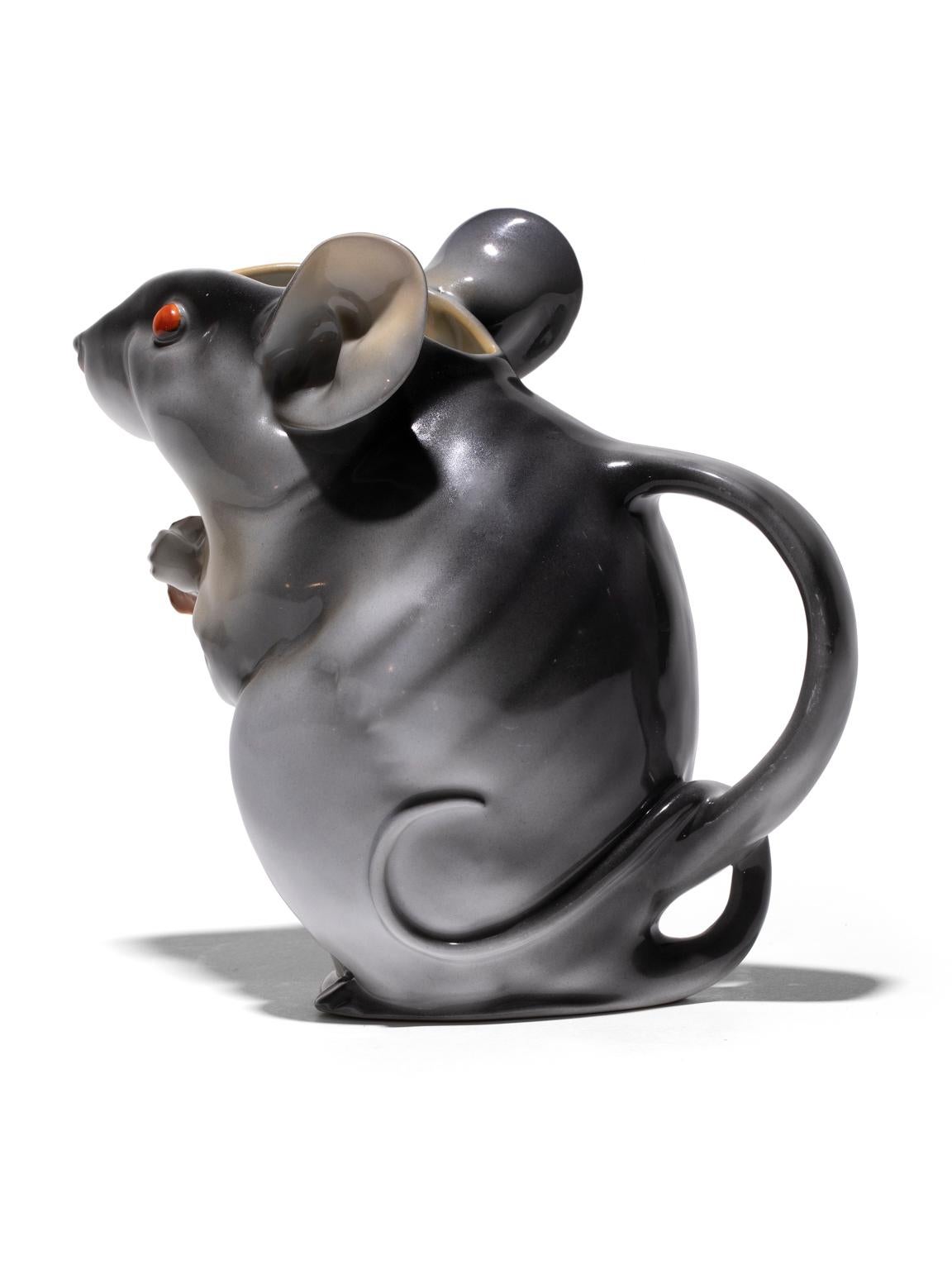 Royal Bayreuth Mouse Pitcher is glazed in soft grays with sparkling red eyes. This piece is extremely rare. The size being 8.5 inches high when normally this mouse is 6 inches. The bottom is marked: 