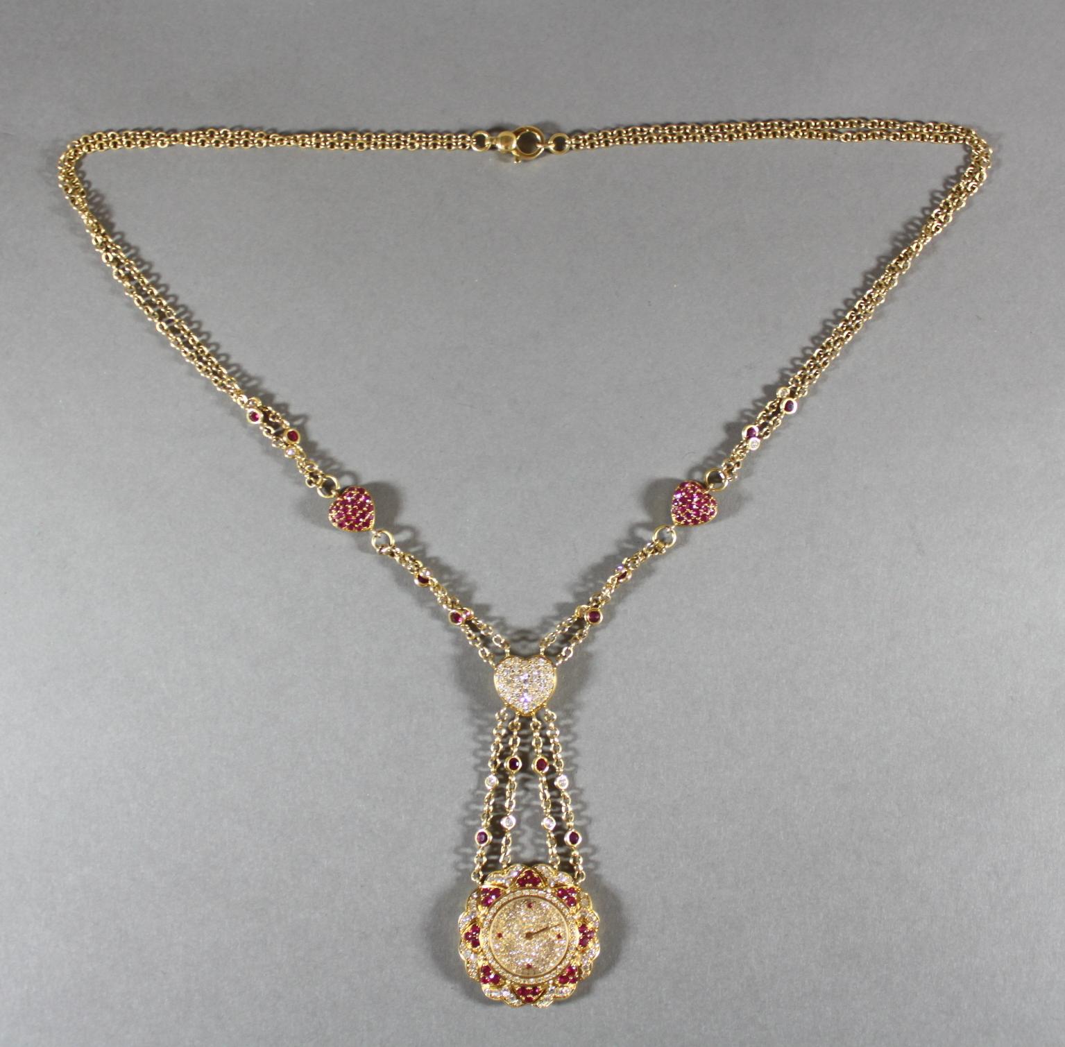 Moussaieff 18k gold ladies necklace pendant watch with diamonds and rubies.
Made in Israel / Switzerland Circa 2000's

Dimensions - 
Necklace Length x Width : 65.5 x 0.6 cm
Watch Diameter x Width : 3.6 x 0.8 cm
Weight : 85 grams

Gender: