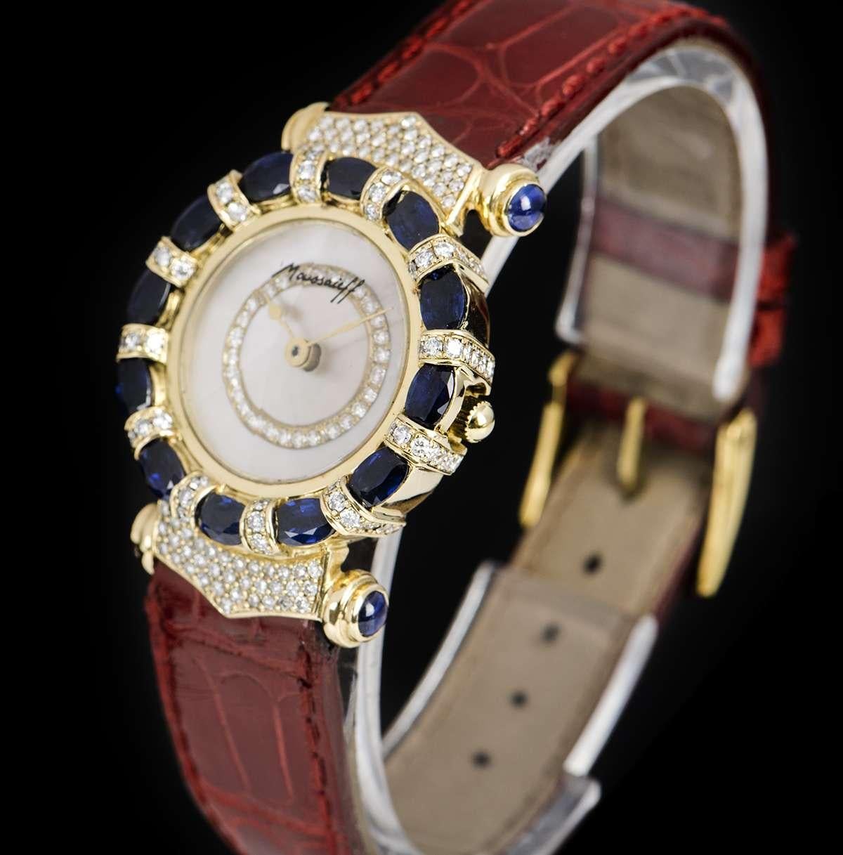 An 18k Yellow Gold Elegance Ladies Wristwatch, mother of pearl dial set with approximately 26 round brilliant cut diamonds (~0.17ct), a fixed 18k yellow gold bezel and case set with approximately 12 oval cut sapphires (~3.00ct) and approximately 72