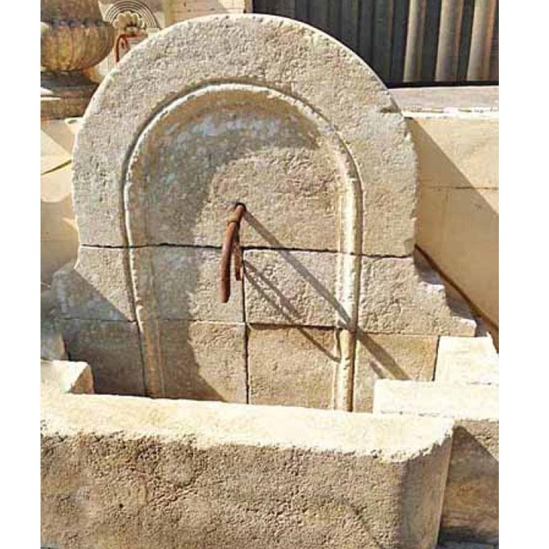 French limestone wall fountain with an arched shaped wall and a staggered basin.

Origin: France

Measurements: 4'3