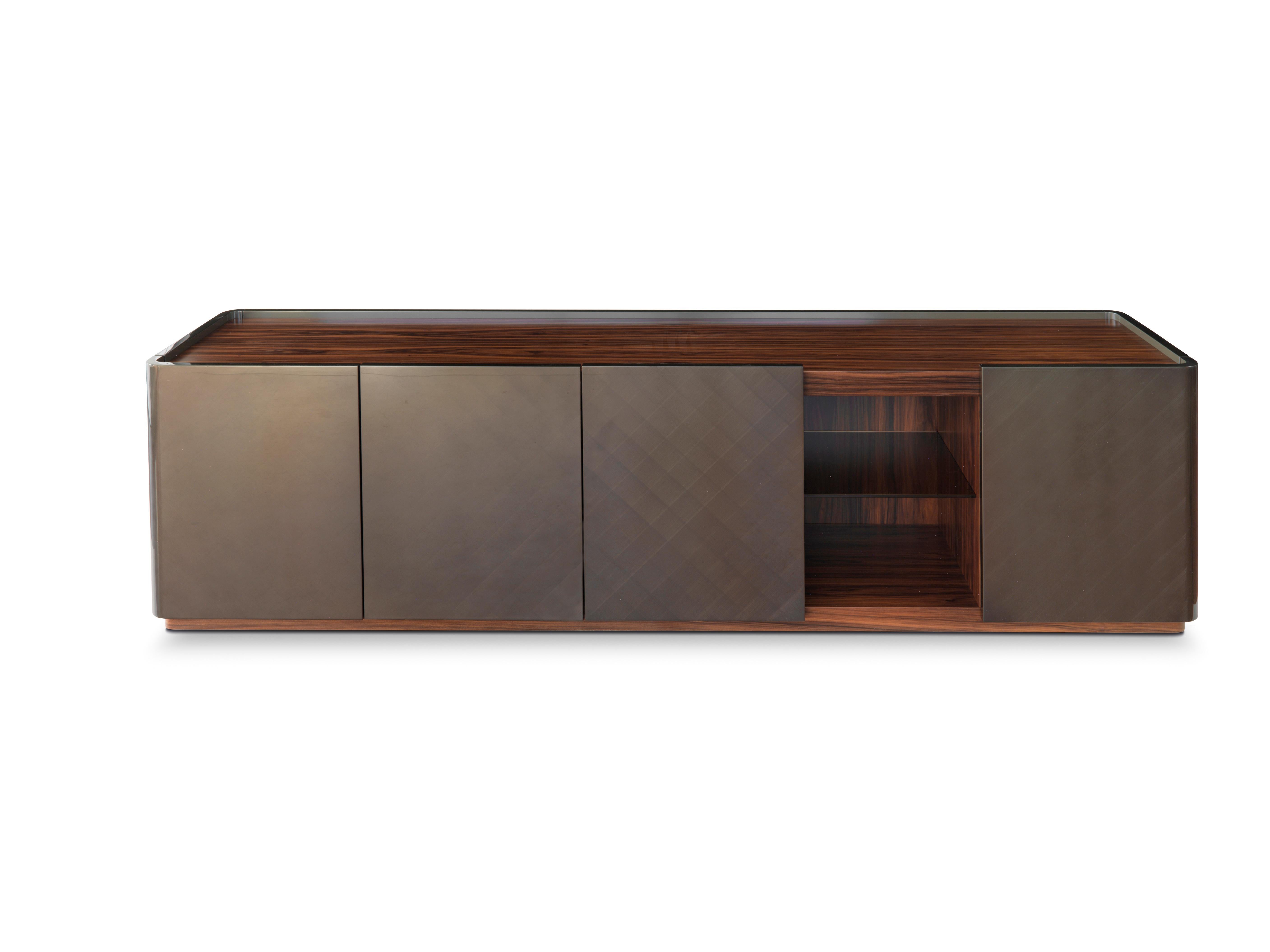 Moustique 5041 Sideboard by Redeco
Dimensions: W 240 x D 55 x H 65 cm
Materials: Lightened mdf and mdf structure. Two outer curved doors with magnetic closing, two central doors with soft closing. Three bronze glass shelves and one internal drawer