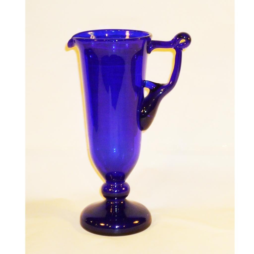 Mouth-blown Biedermeier jug made of cobalt glass, first half of the 19th century
Mouth-blown, slim water/wine jug made of cobalt glass with beautifully shaped handle, Biedermeier style.
