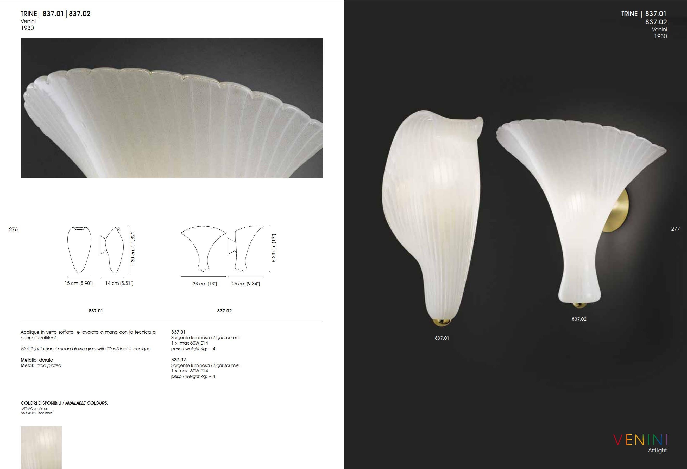 Semi-opaque white mouth-blown sculptural glass wall sconce, made in Italy by Venini. Venini was established in 1921 by Paolo Venini, a Milanese lawyer, and Giacomo Cappellin, a Venetian antiquarian. Venini’s master glass-makers create these