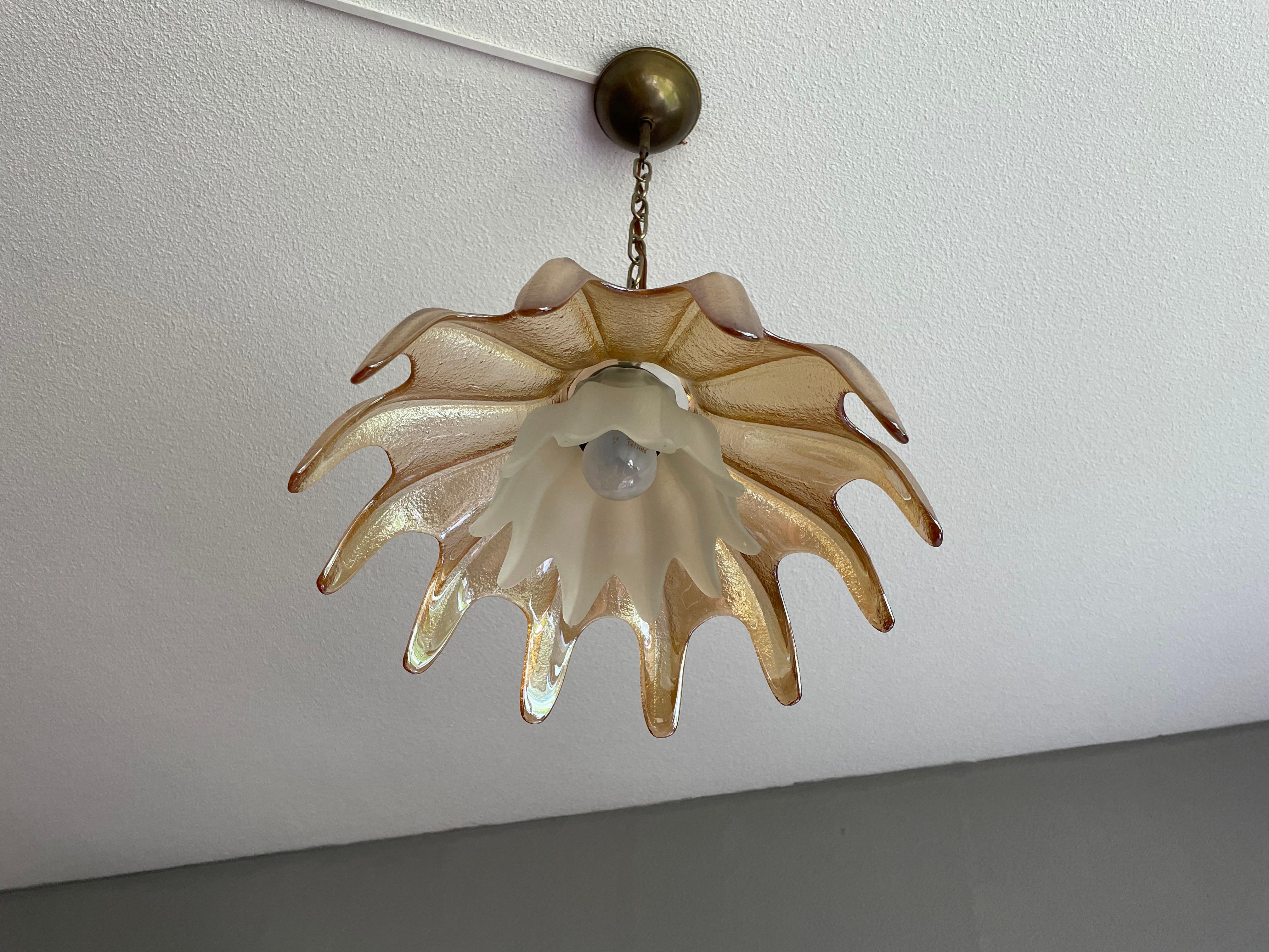 Stunning and mint condition, handcrafted Murano light from the midcentury era.

This beautiful design and superbly executed Murano pendant is in great condition and both with the light on and off it radiates a natural elegance that is hard to put