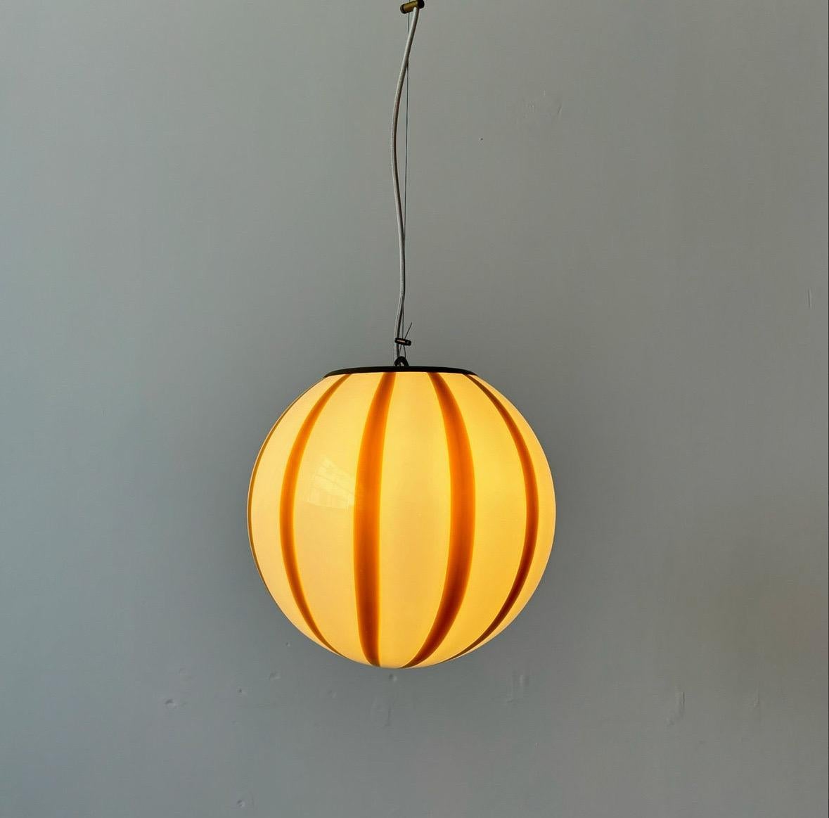 Contemporary Mouth blown Murano amber stripes pendant lamp, made in Murano island, Italy For Sale