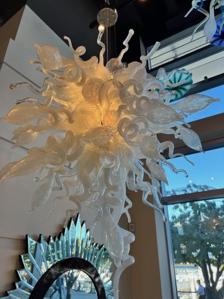 Mouth blown white and clear chandelier blown in the murano style. Very organic sea shapes. Can be mounted tight to ceiling 48