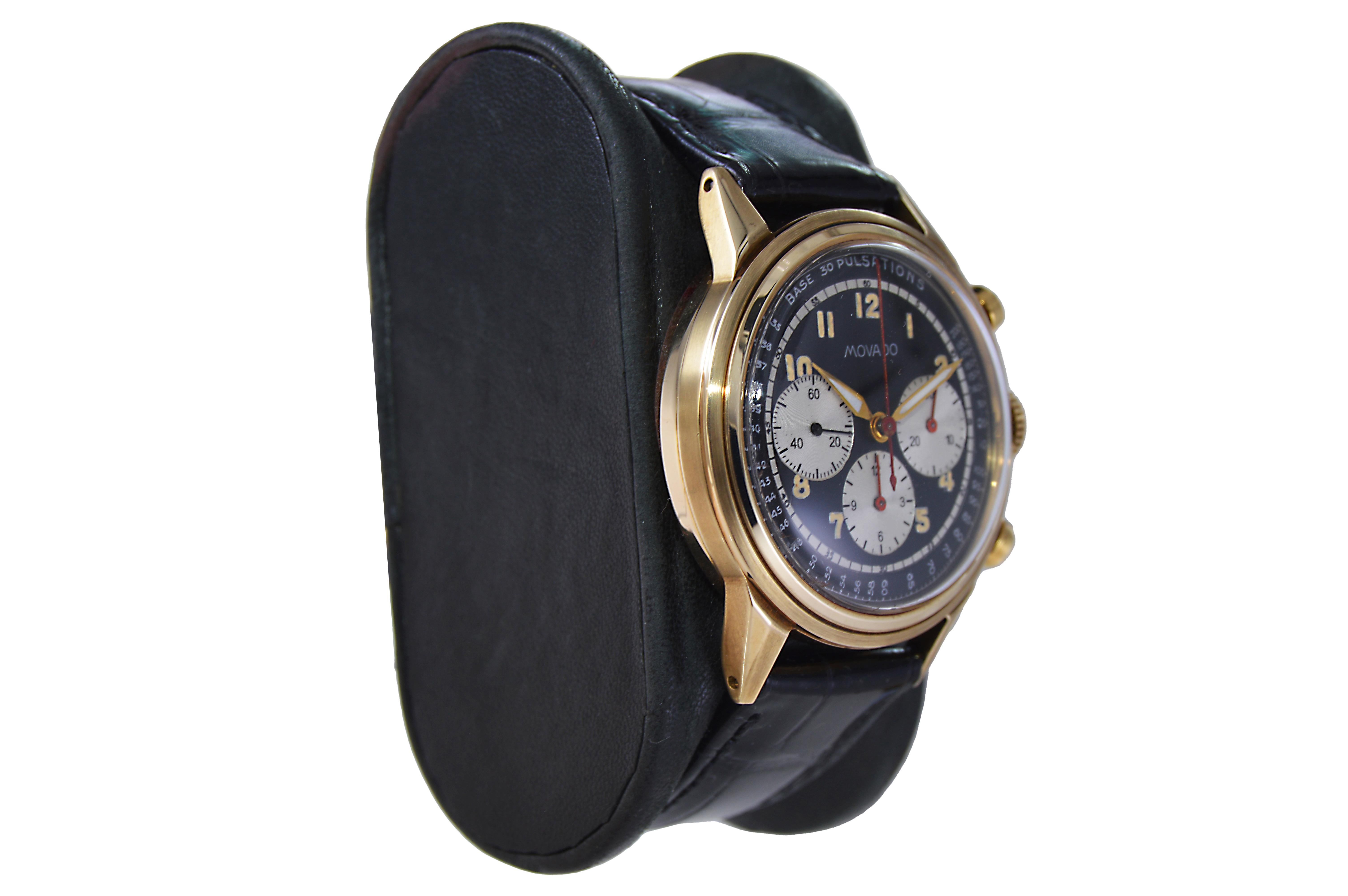 FACTORY / HOUSE: Movado Watch Company
STYLE / REFERENCE: Art Deco / Triple Register Chronograph
METAL / MATERIAL: 14Kt. Solid Yellow Gold
DIMENSIONS: Length 42mm X Diameter 35mm
CIRCA: 1940's
MOVEMENT / CALIBER: Manual Winding / 17 Jewels 
DIAL /