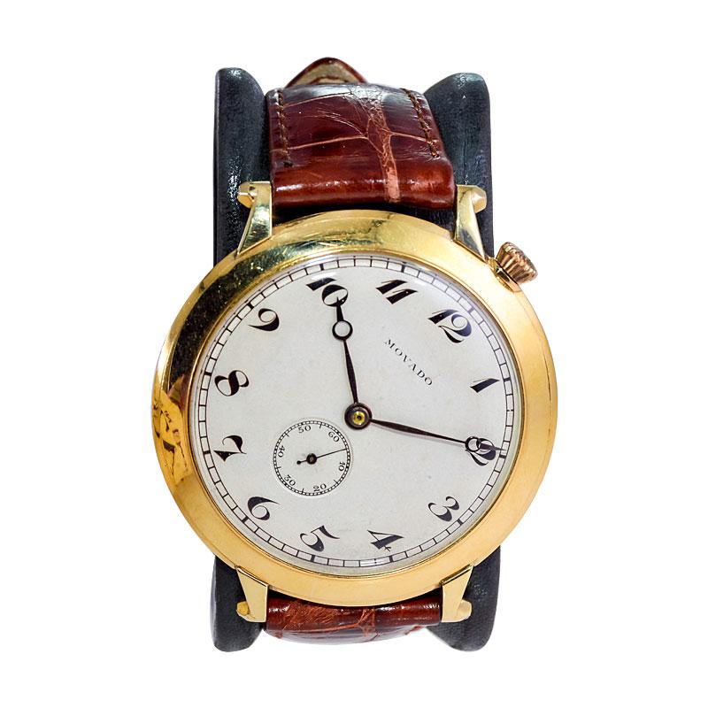 FACTORY / HOUSE: Movado Watch Company
STYLE / REFERENCE: Art Deco Oversized Watch
METAL / MATERIAL: 14Kt. Solid Gold 
CIRCA / YEAR: 1920's
DIMENSIONS / SIZE: Length 50mm X Diameter 45mm
MOVEMENT / CALIBER: Manual Winding / 17 Jewels 
DIAL / HANDS: