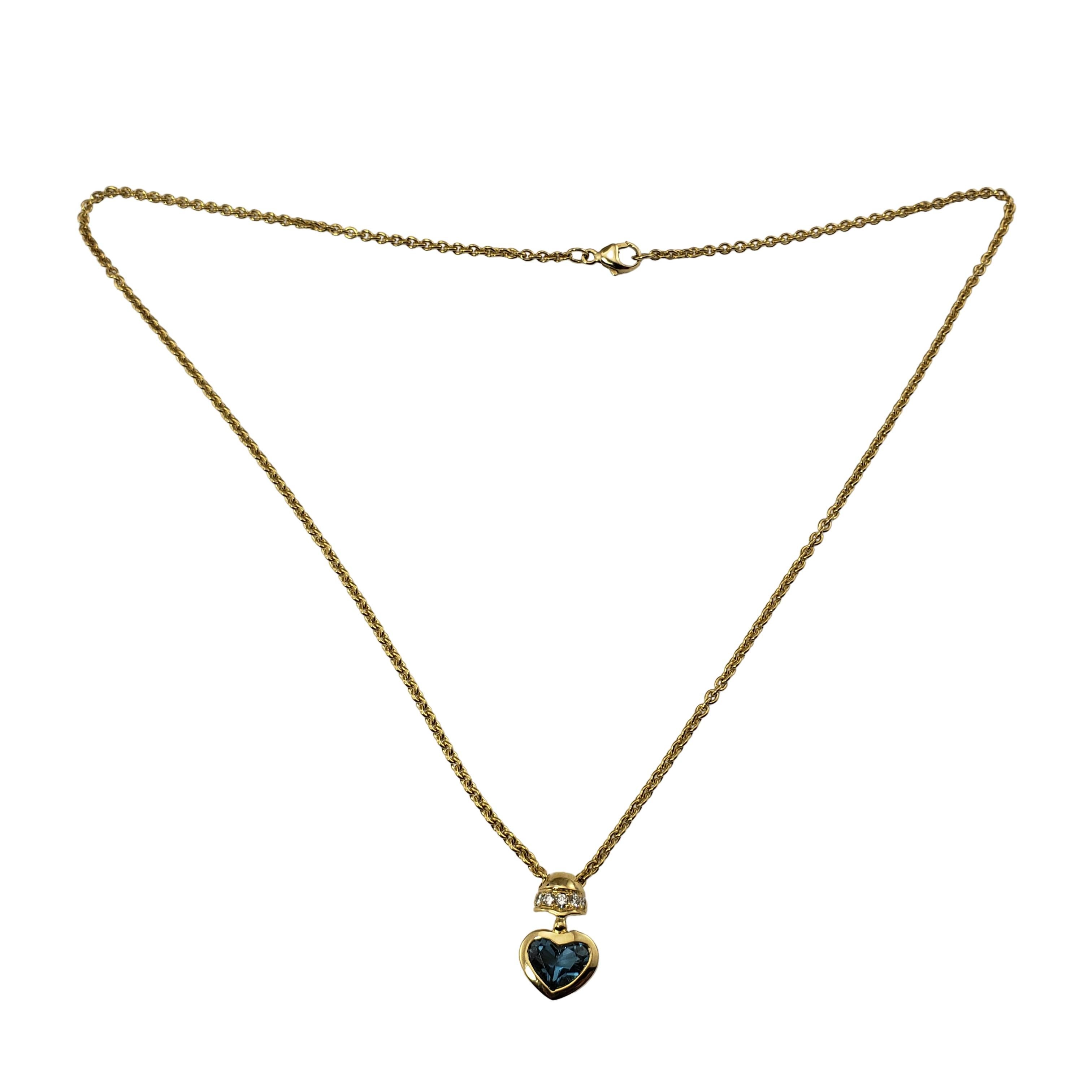 Vintage Movado 18 Karat Yellow Gold Blue Topaz and Diamond Heart Necklace Pendant-

This lovely heart pendant necklace features a stunning blue topaz stone and five round brilliant cut diamonds set in beautifully detailed 18K yellow