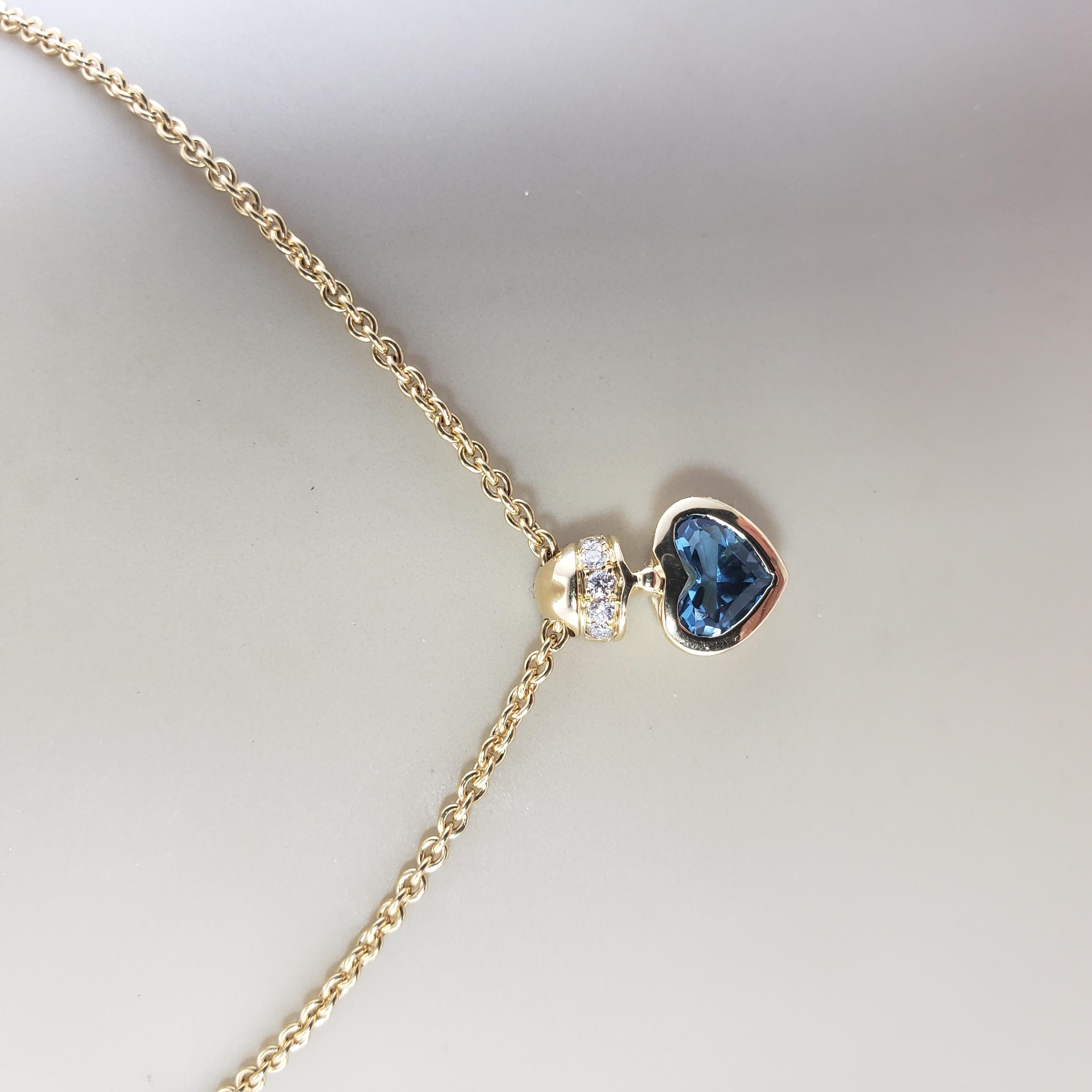 Women's Movado 18 Karat Yellow Gold Blue Topaz and Diamond Heart Pendant Necklace