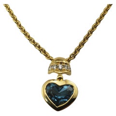 Movado 18 Karat Yellow Gold Blue Topaz and Diamond Heart Pendant Necklace