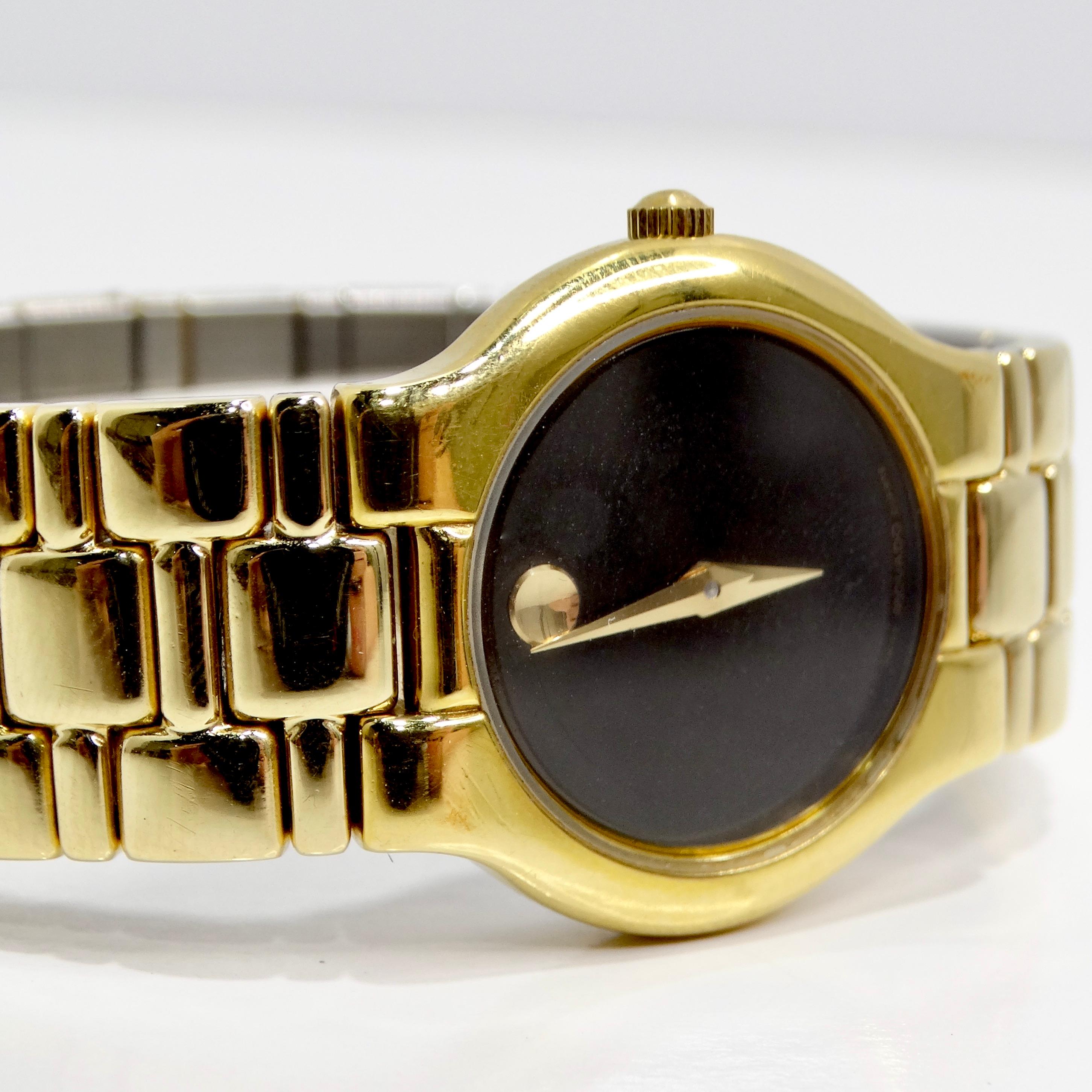 Voici la montre Movado plaquée or 18 carats, une montre-bracelet classique, intemporelle et élégante, qui allie luxe et style raffiné. Ce garde-temps exquis est doté d'un boîtier en acier inoxydable plaqué d'or jaune 18 carats, offrant un look