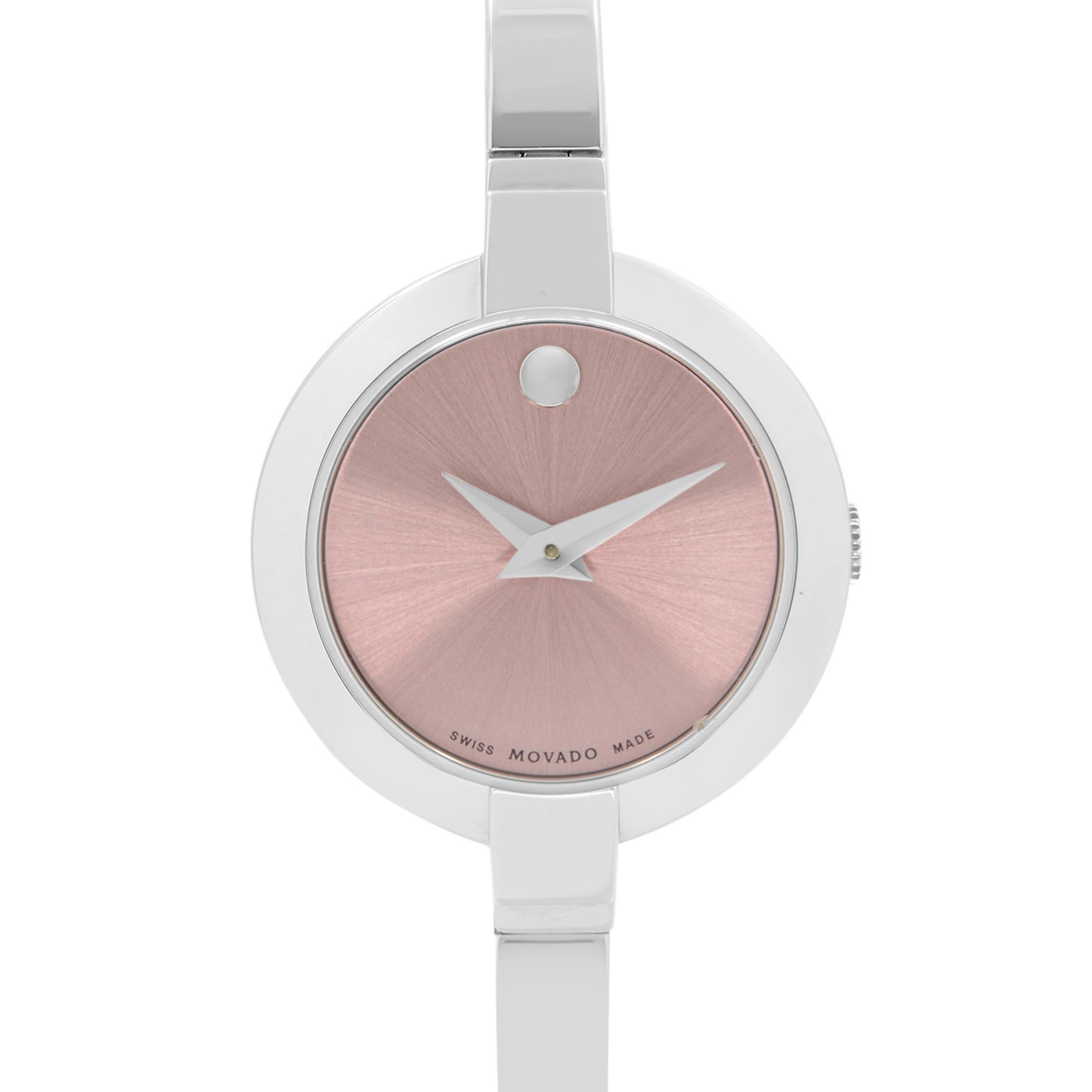 Display Model Movado Bela Stainless Steel Pink Dial Bangle Ladies Quartz Watch 0606596. This Beautiful Timepiece is Powered by Quartz (Battery) Movement And Features: Round Stainless Steel Case with Stainless Steel Bracelet, Fixed Stainless Steel
