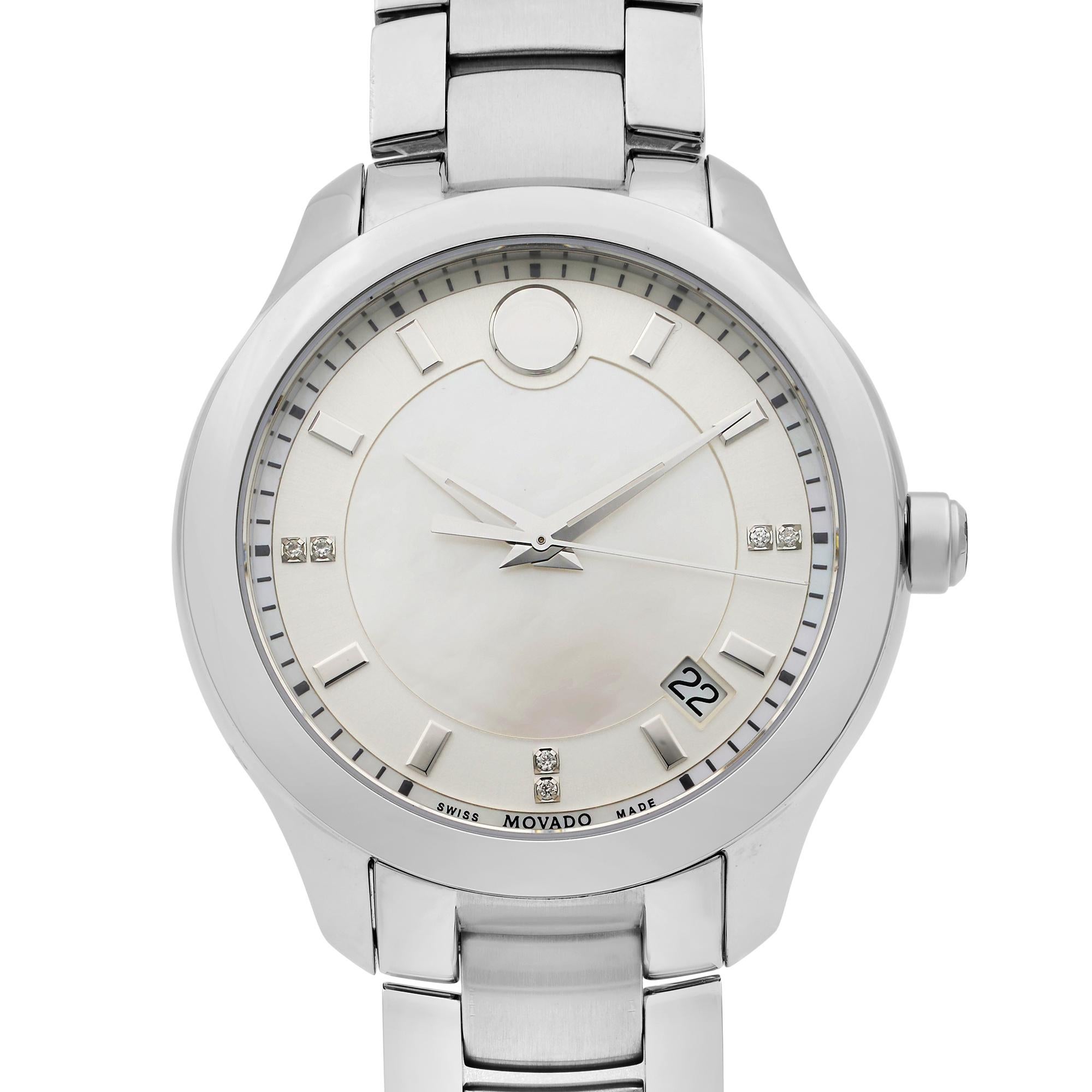 This display model Movado Bellina  0606978 is a beautiful Ladie's timepiece that is powered by quartz (battery) movement which is cased in a stainless steel case. It has a round shape face, date indicator dial and has hand diamonds, sticks style