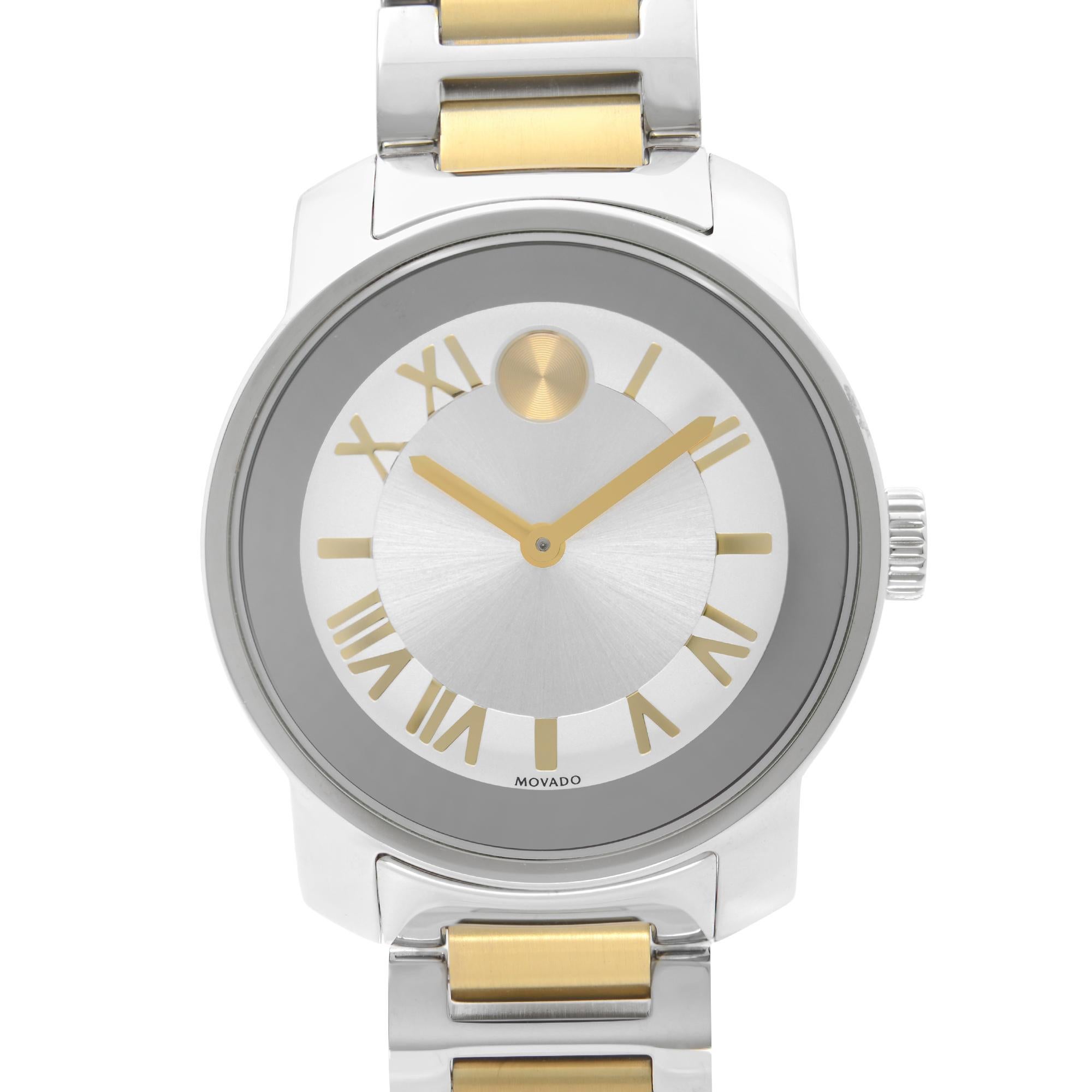 Unworn Movado Bold Ladies Watch 3600245. This Beautiful Timepiece Features: Stainless Steel Case with a Two-Tone (Silver and Gold-tone) Stainless Steel Bracelet. Silver Dial with Gold-Tone Hands and Roman Numeral Hour Markers. The Movado Dot Marks