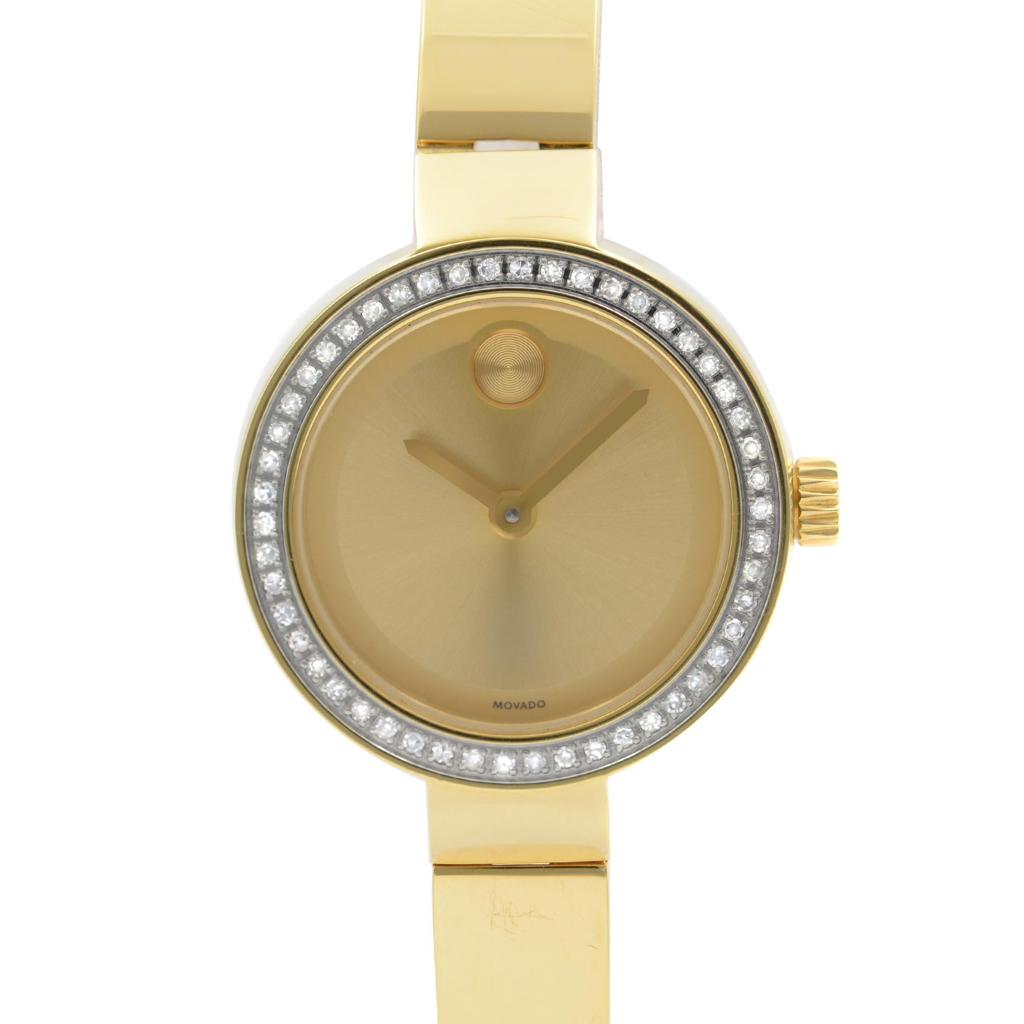 Preowned Movado Bold Dot Gold Dial Yellow Gold-Tone Ladies Watch 3600322. This Beautiful Timepiece Features: Yellow Gold-Tone Stainless Steel Case and Bracelet. Fixed Yellow Gold-Tone Bezel Set with Diamonds. Gold-Tone Dial with Gold-Tone Hands. No