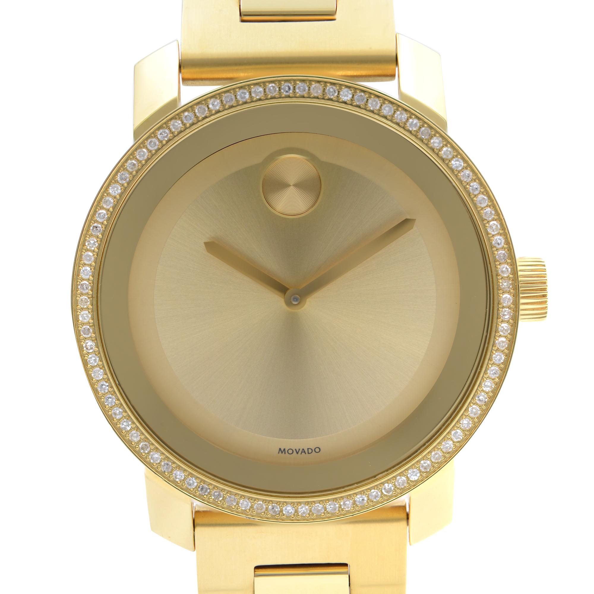 Pre-owned Movado Bold Steel 36mm Diamond Bezel Gold Dial Quartz Unisex Watch 3600150. Timepiece Has Some Tiny Scratches on the Bracelet, Case, and Case Back. This Beautiful Timepiece Features: Yellow Gold Ion-Plated Stainless Steel Case and