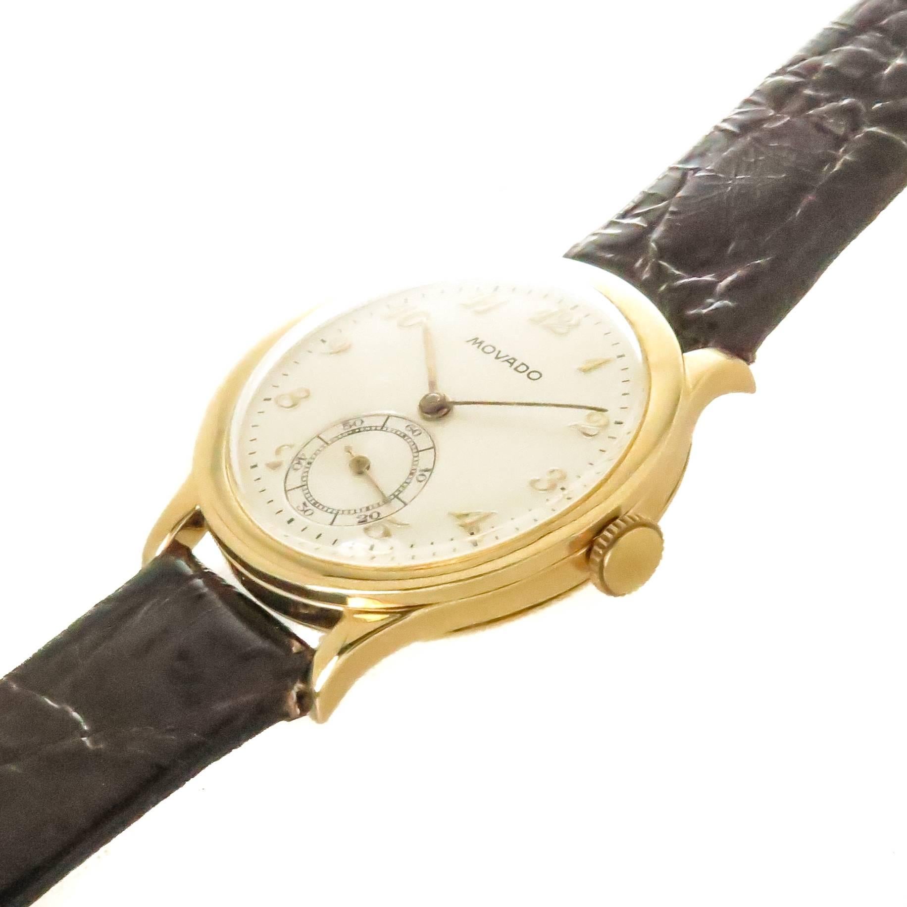Circa 1940s Movado Wrist watch, 32 MM 3 Piece 18K yellow Gold Calatrava Case. 15 Jewel, Caliber 75, mechanical, manual wind Movement.  Silver White dial with raised Gold Markers and a sub seconds chapter. New Brown Crocodile Strap. Watch length 8