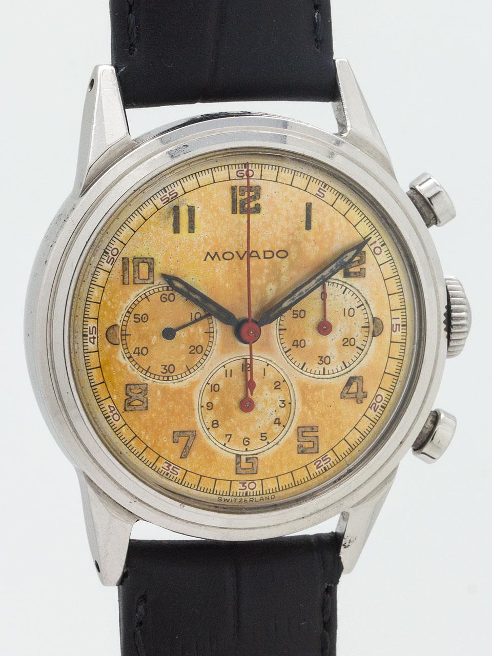 
Vintage Movado chronograph circa 1950’s featuring 34.5mm diameter case, faceted and tapered lugs, round chronograph pushers, original mushroom style Movado crown, and with richly patina’d straw colored original dial with aged luminous indexes, red