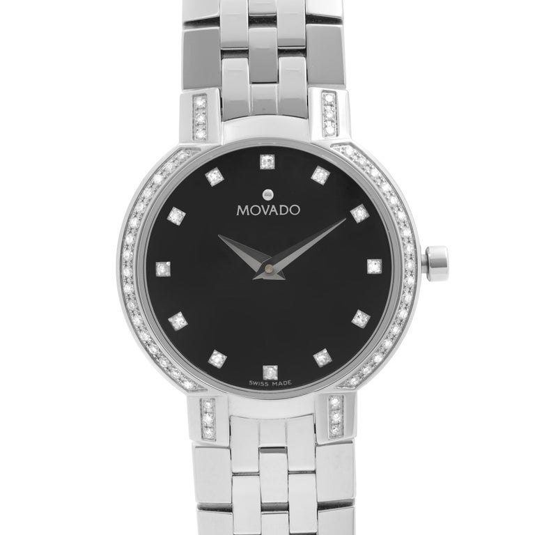 Unworn Movado Faceto Diamonds Stainless Steel Black Dial Quartz Ladies Watch 0605586. This Beautiful Timepiece Features: Stainless Steel Case and Bracelet, Fixed Stainless Steel Bezel Set with Diamonds, Black Dial with Silver-Tone Dauphine Hands,