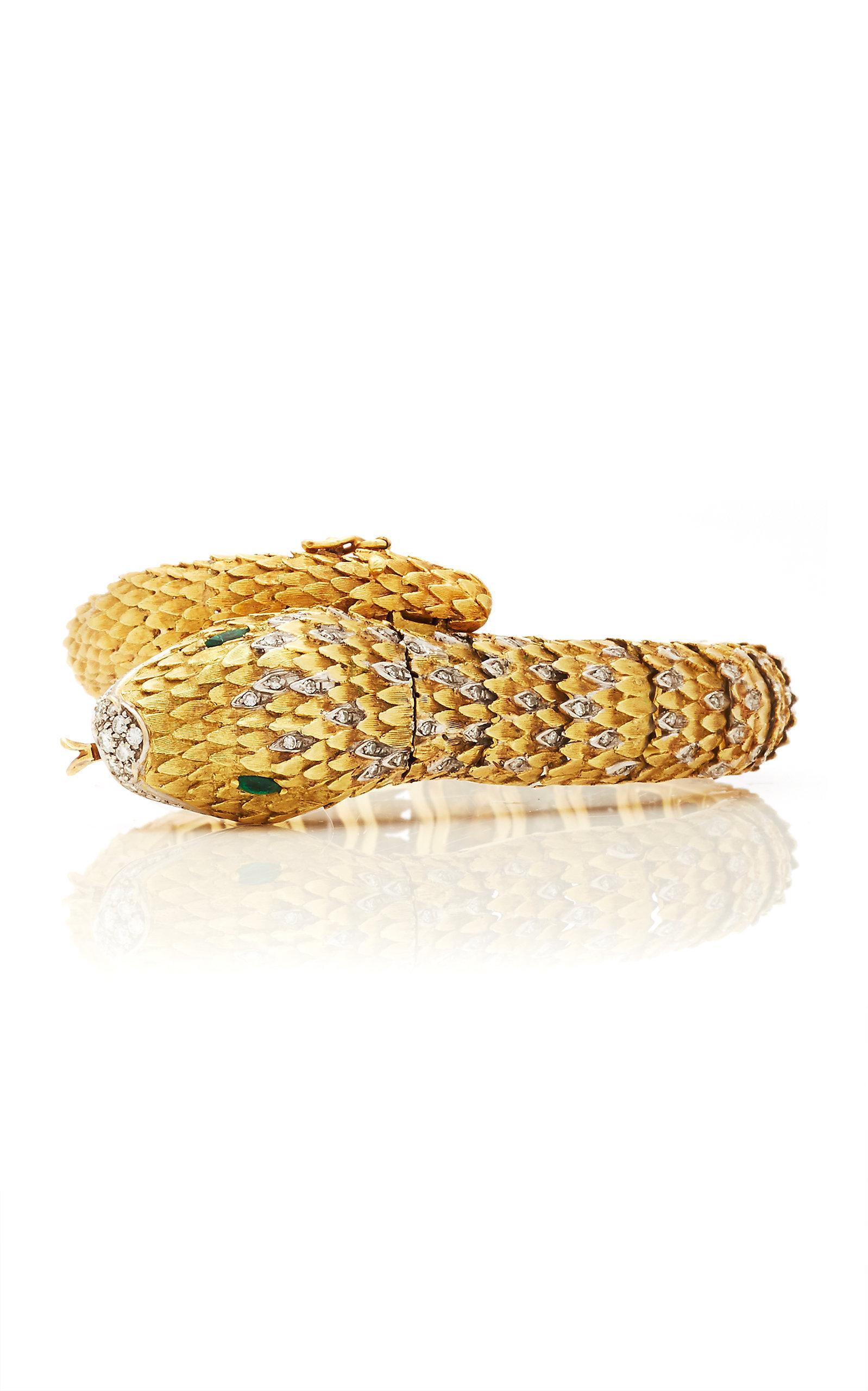 Montre-bracelet serpent en or bicolore, diamants et émeraudes, unique en son genre, de Movado, vers 1970.
