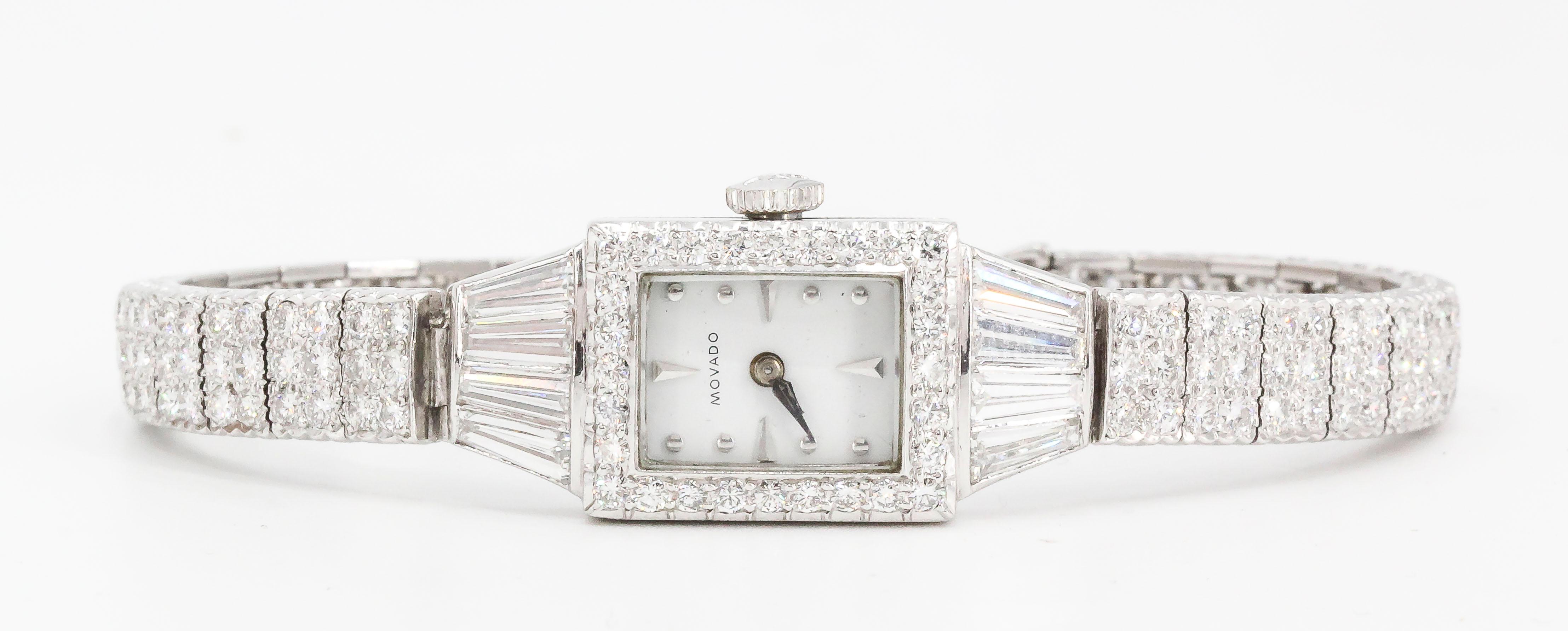 Chic diamond and platinum ladies wrist watch by Movado, circa mid century. It features high grade round brilliant cut and tapered baguette cut diamonds, approx. 5.0 cts total weight. Mechanism is mechanical. Measures approx. 6