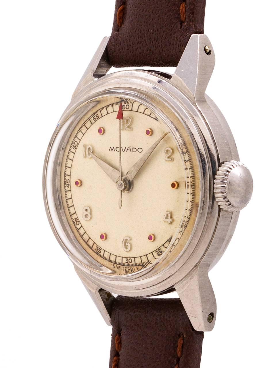 
Vintage lady Movado 22 X 29mm case in stainless steel stepped design case with screw down caseback and original mushroom style crown, circa 1940’s. Featuring acrylic crystal, and beautiful condition original silvered satin dial with ruby indexes