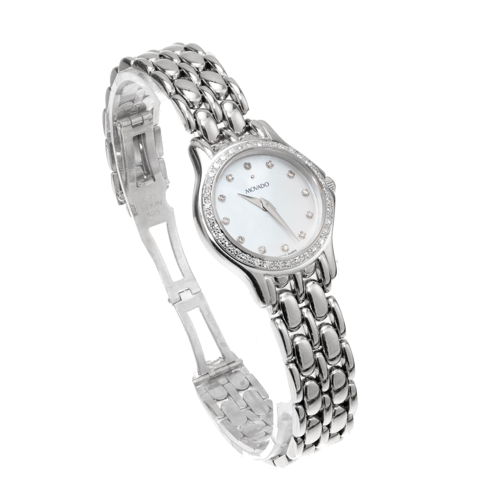 Lady's Movado 14k white gold wristwatch with a diamond bezel and diamond markers. 

Length: 27.18mm
Width: 22.48
Band width at case: 10.50mm
Case thickness: 5.75mm
Band: 14k white gold panther
Crystal: sapphire
Dial: white with diamond