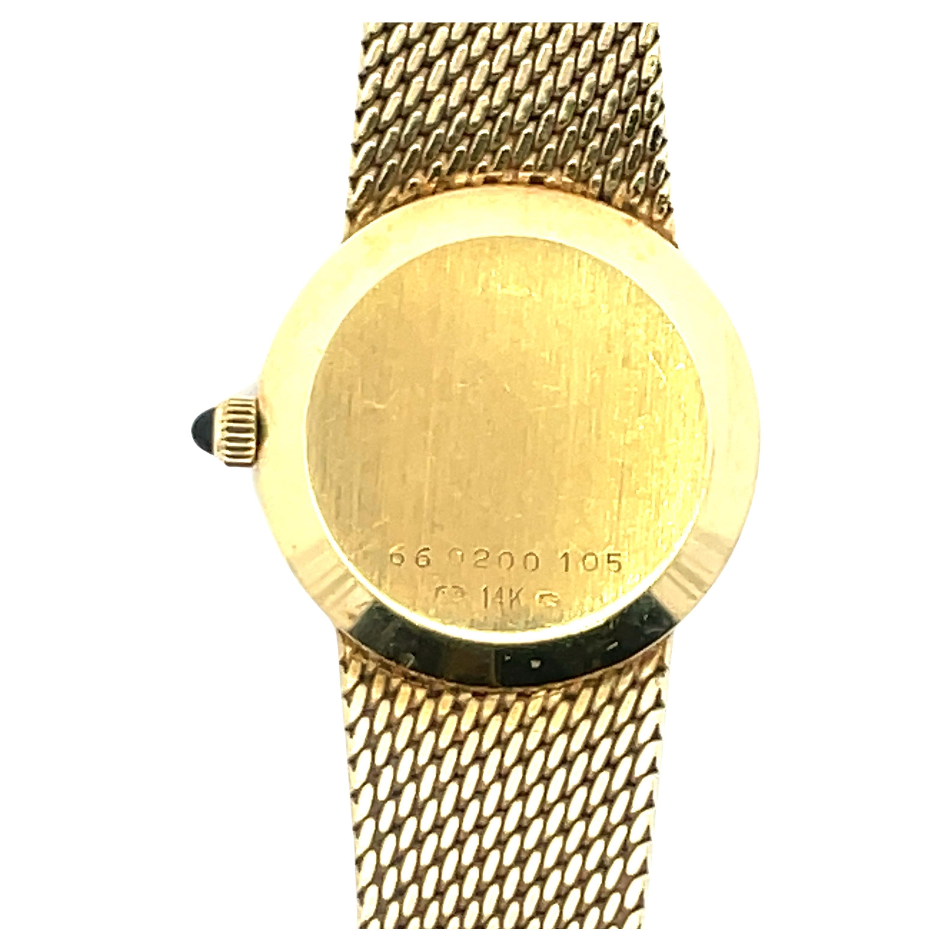 movado 18k solid gold watch