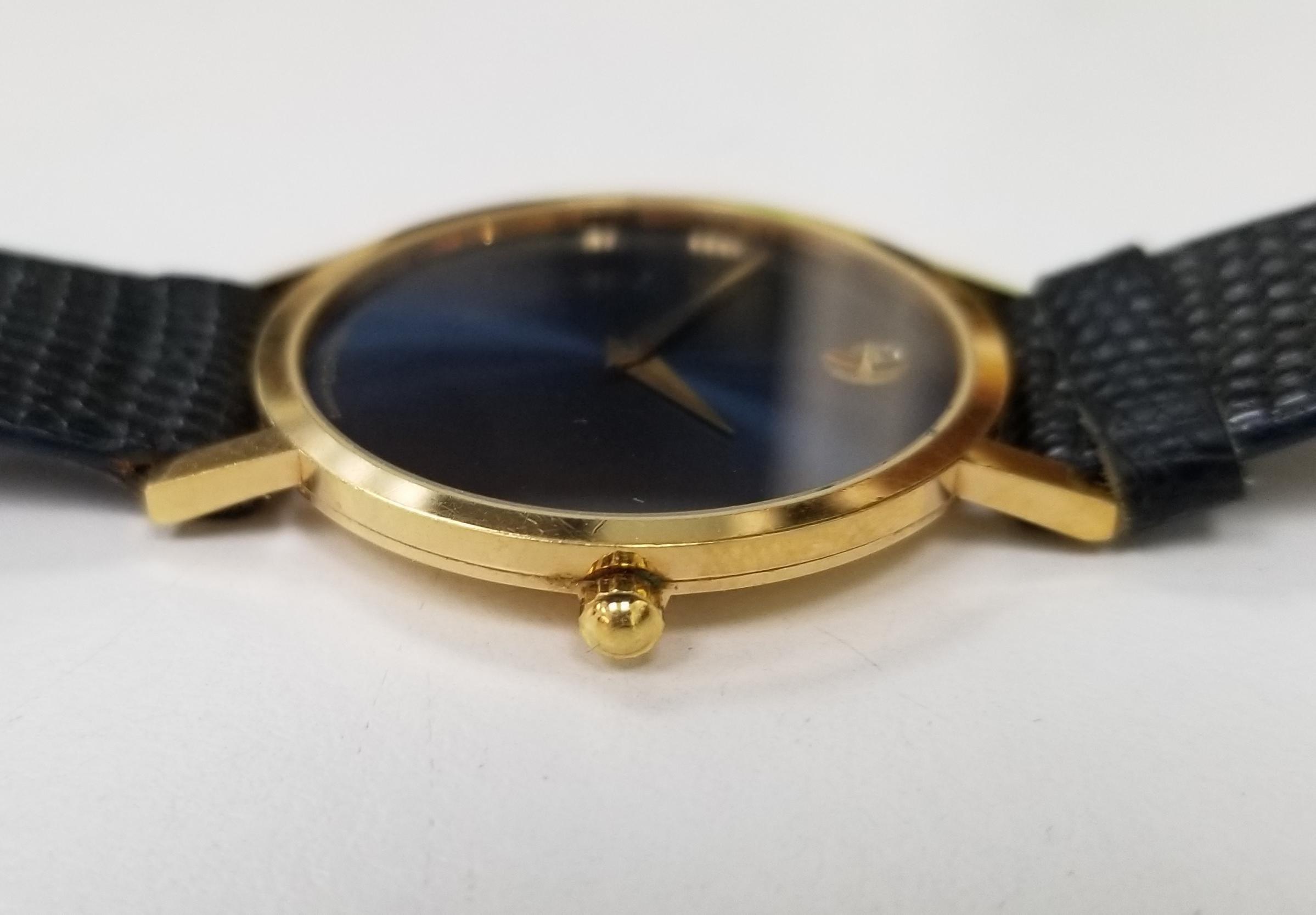 The Movado Museum Classic watch, reference number 188436, is a member of the esteemed “Museum Classic” collection.

This timepiece is presented with a yellow gold PVD-plated stainless steel case that measures 30.6 mm in diameter. The watch is