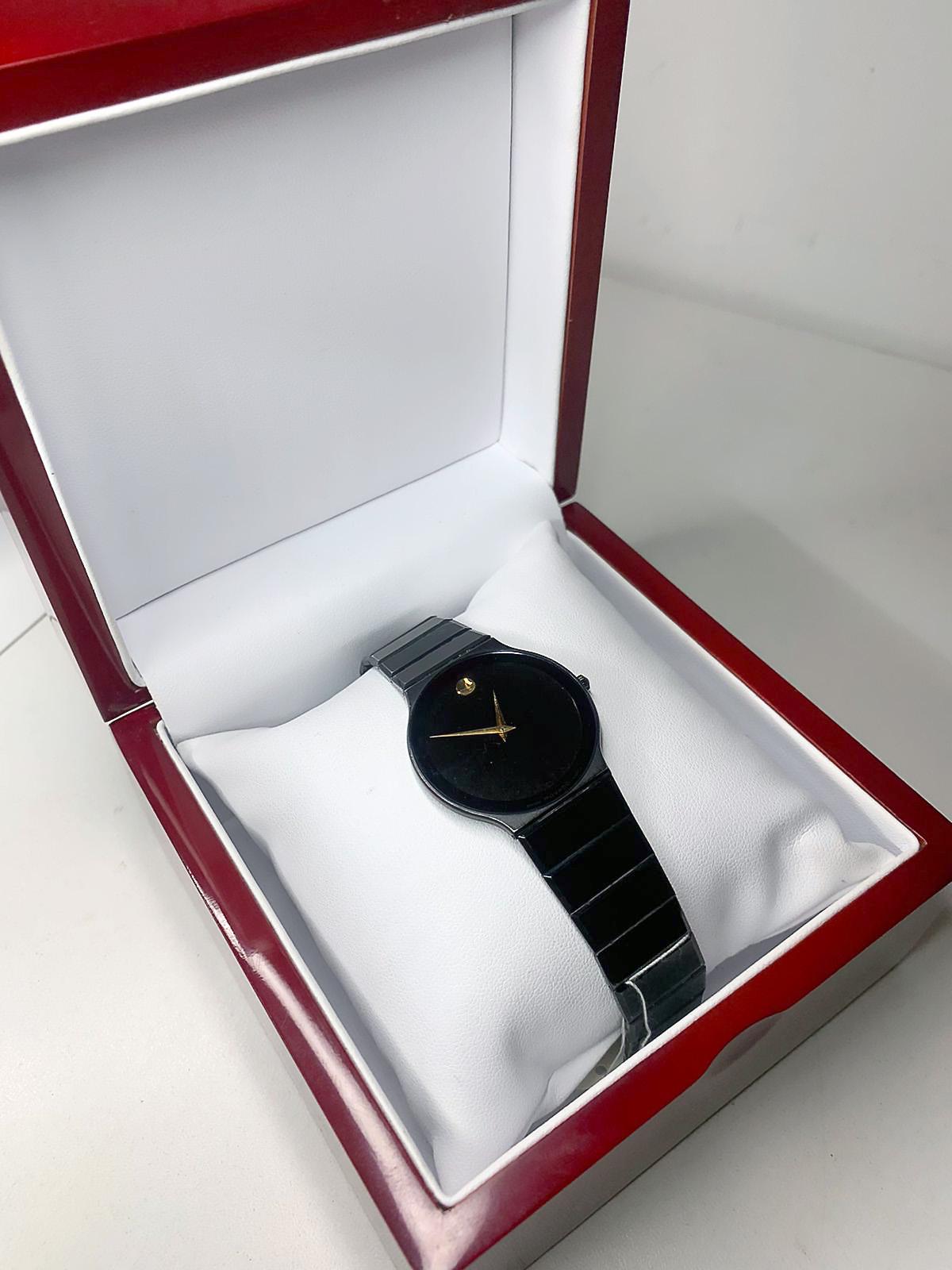 movado black and gold