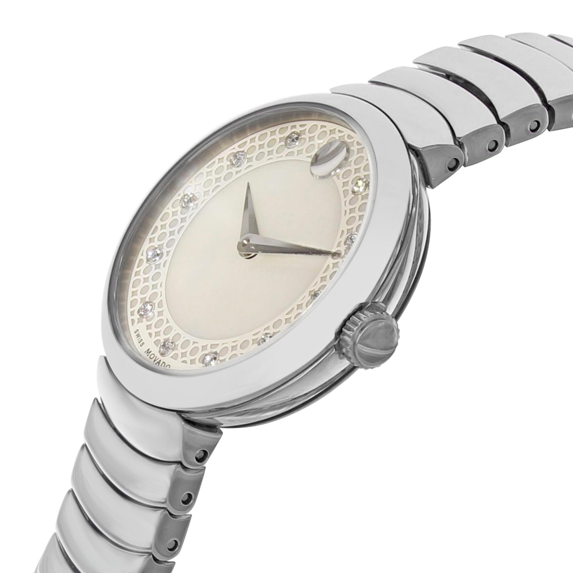 This display model Movado Myla 0607044 is a beautiful Ladies timepiece that is powered by a quartz movement which is cased in a stainless steel case. It has a round shape face, diamonds dial and has hand diamonds style markers. It is completed with
