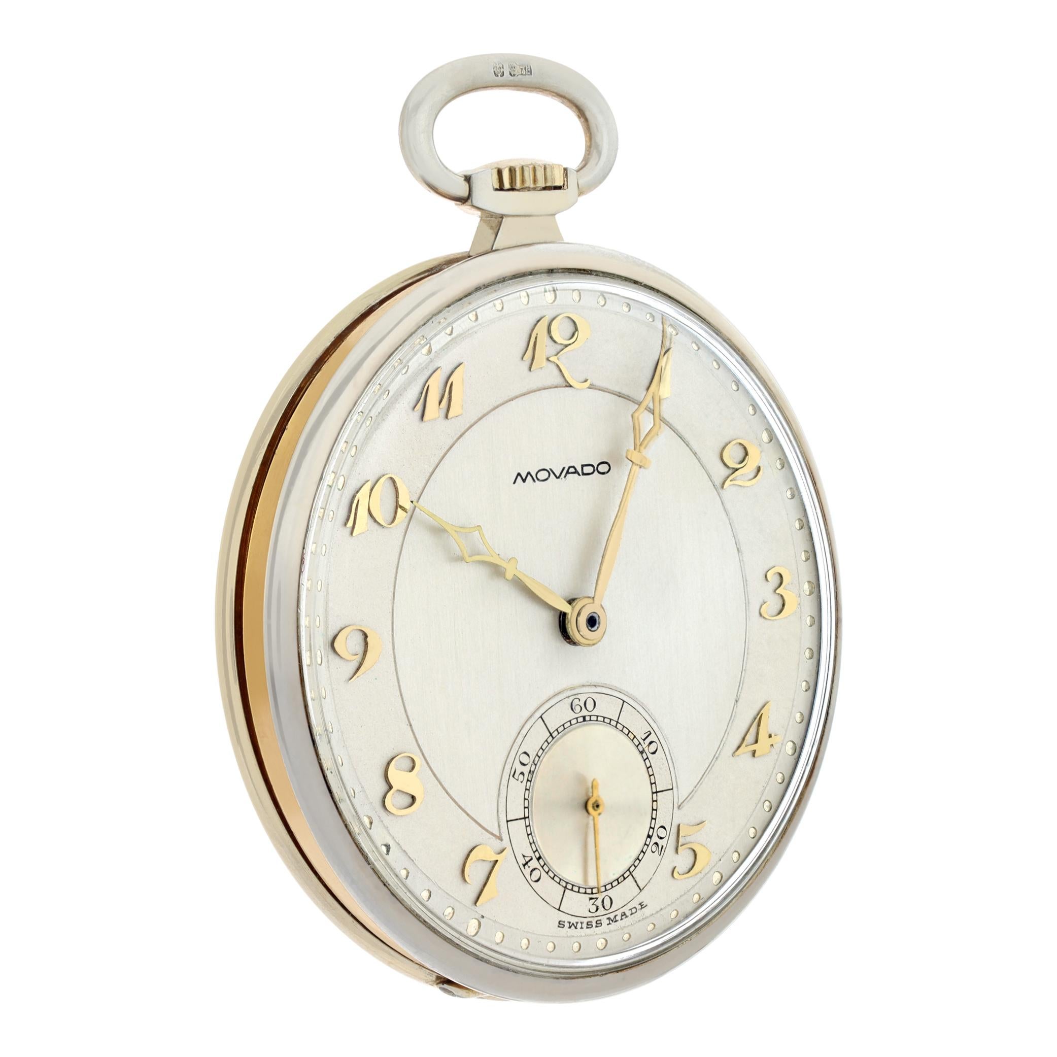 Movado 18k white and yellow pocket watch. Manual w/ subseconds. 42 mm case size. Ref 7163. Fine Pre-owned Movado Watch.

 Certified preowned Vintage Movado pocket watch 7163 watch is made out of yellow gold. This Movado watch has a 42 x 42 mm case