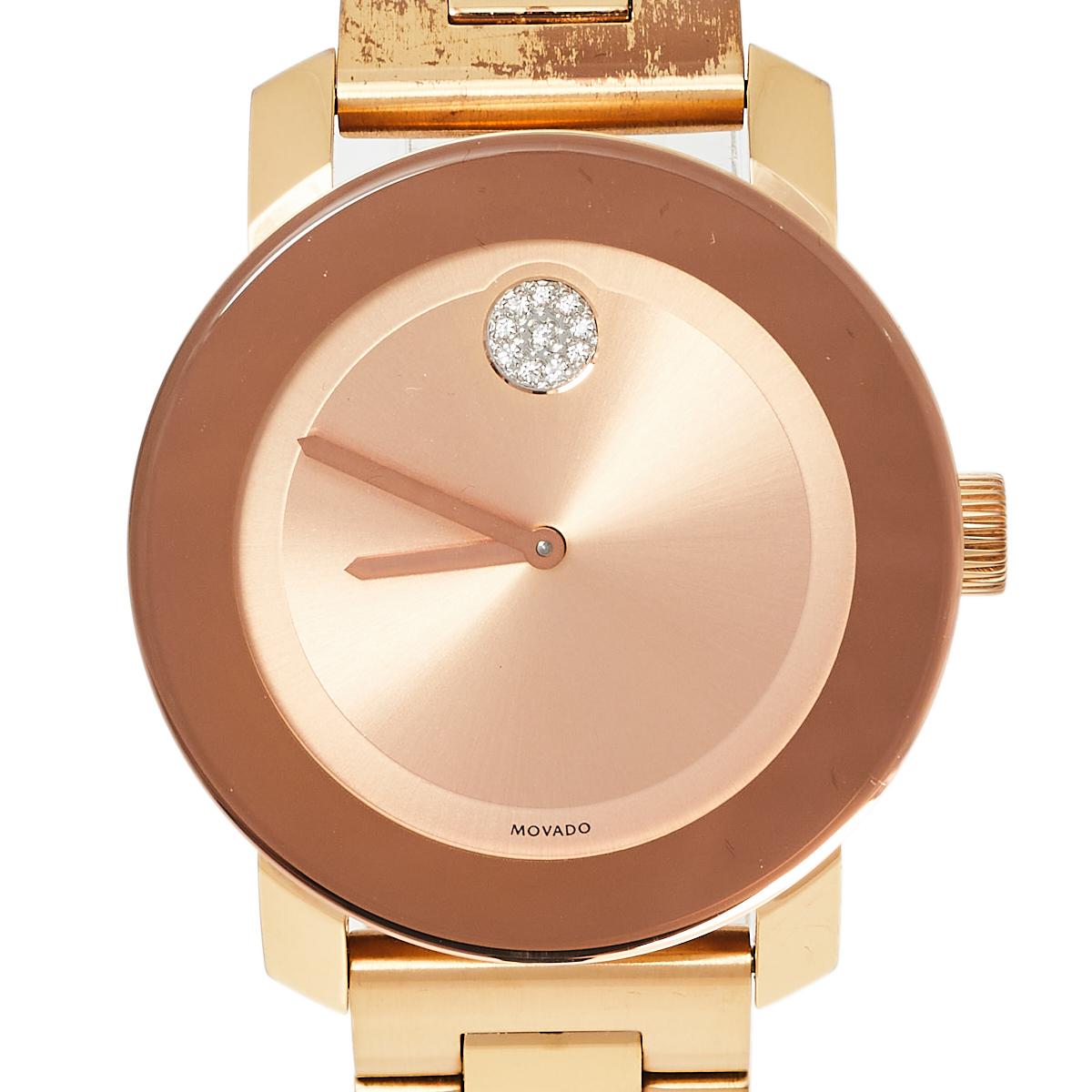 Built to assist you every day, this Movado wristwatch comes made from rose gold-plated stainless steel. The quartz watch features a rose gold dial with two hands and the signature Movado dot beautifully embellished with crystals. It is