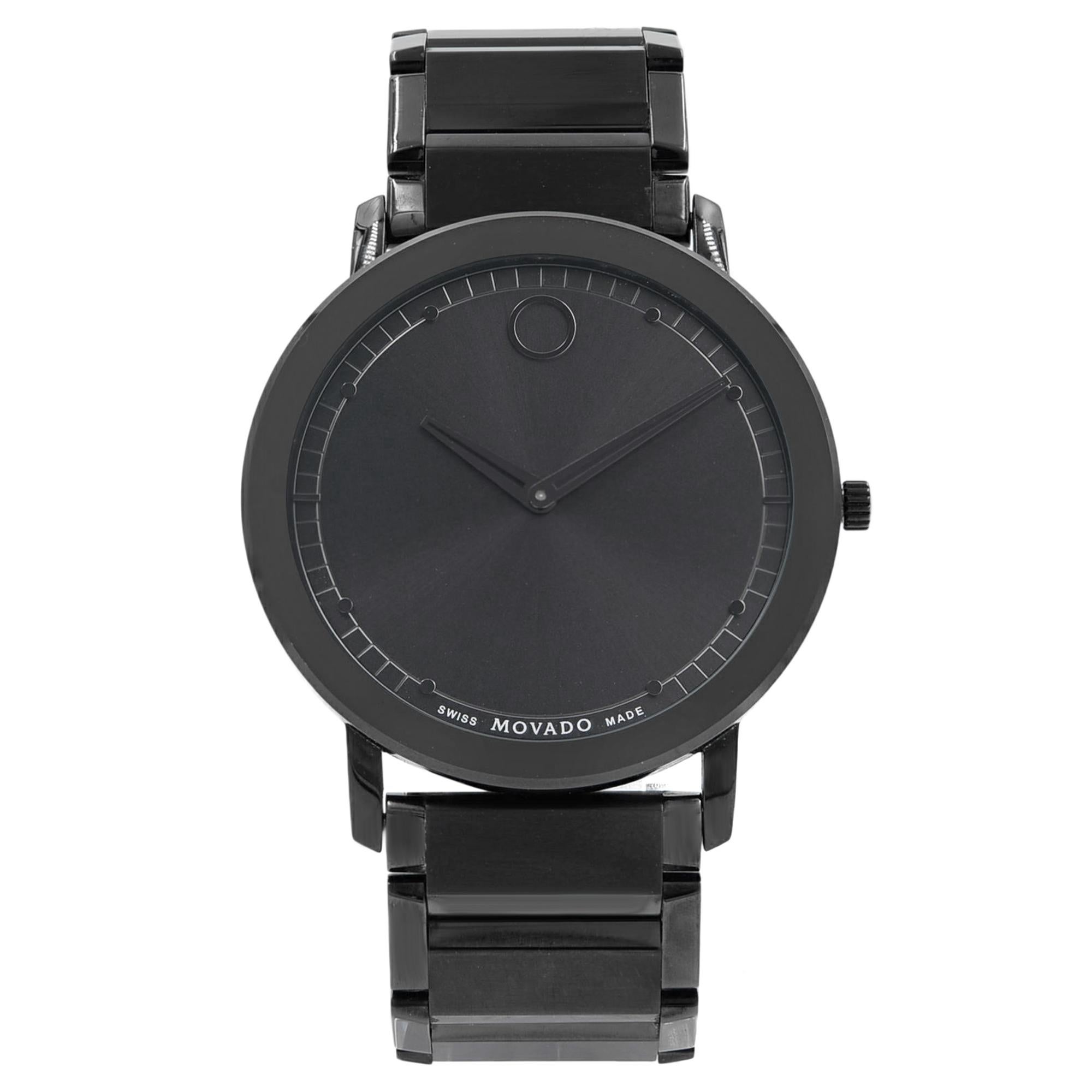 This pre-owned Movado Sapphire  0606882 is a beautiful men's timepiece that is powered by a quartz movement which is cased in a stainless steel case. It has a round shape face, no features dial and has hand sticks style markers. It is completed with