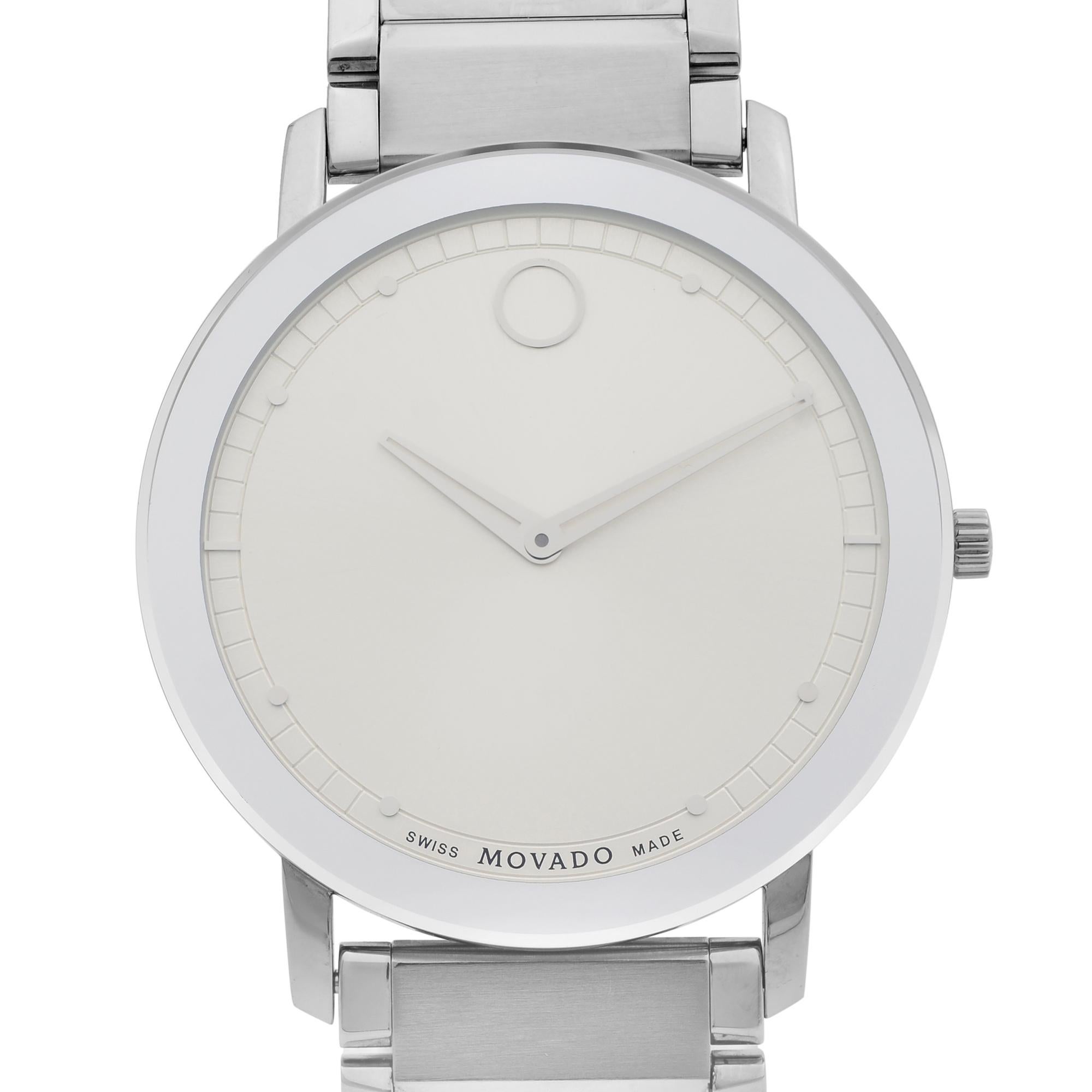 This pre-owned Movado Sapphire 0606881 is a beautiful men's timepiece that is powered by quartz (battery) movement which is cased in a stainless steel case. It has a round shape face, no features dial and has hand dots style markers. It is completed