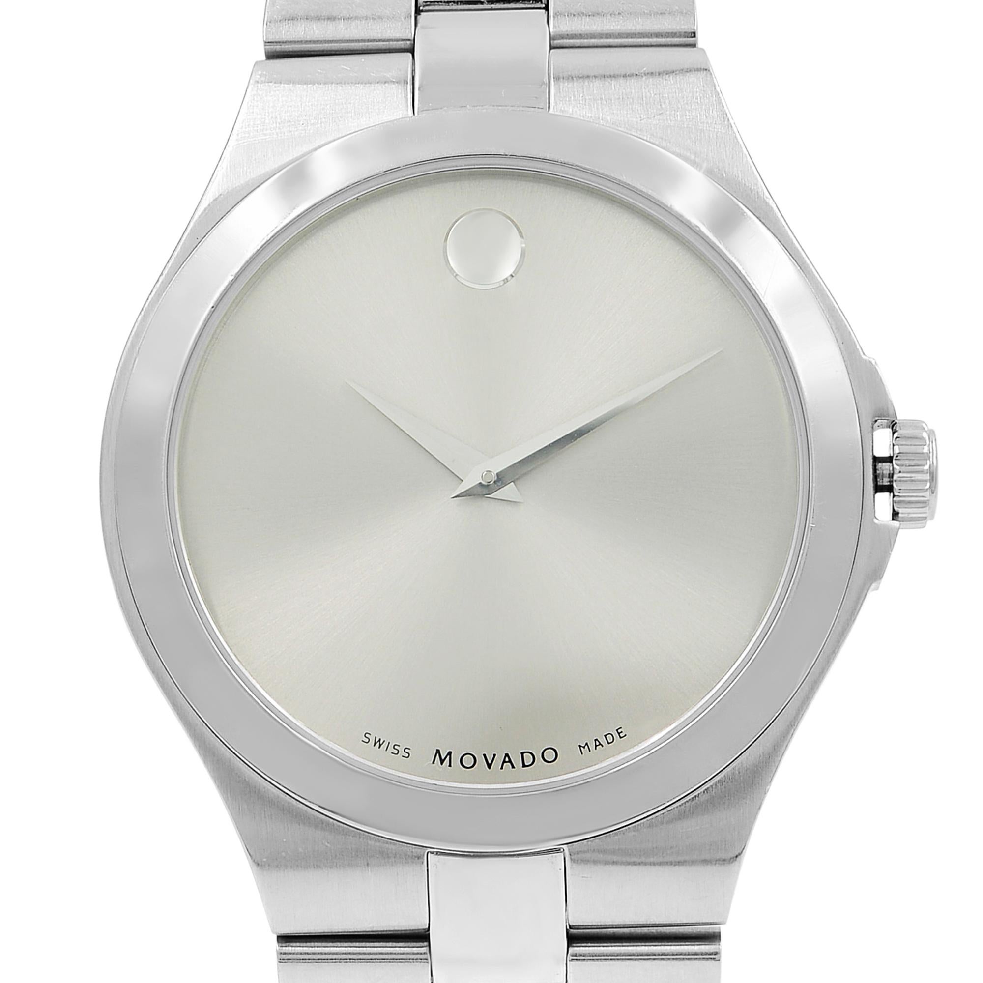 This pre-owned Movado Serio 0606556 is a beautiful men's timepiece that is powered by a quartz movement which is cased in a stainless steel case. It has a round shape face, no features dial and has hand unspecified style markers. It is completed