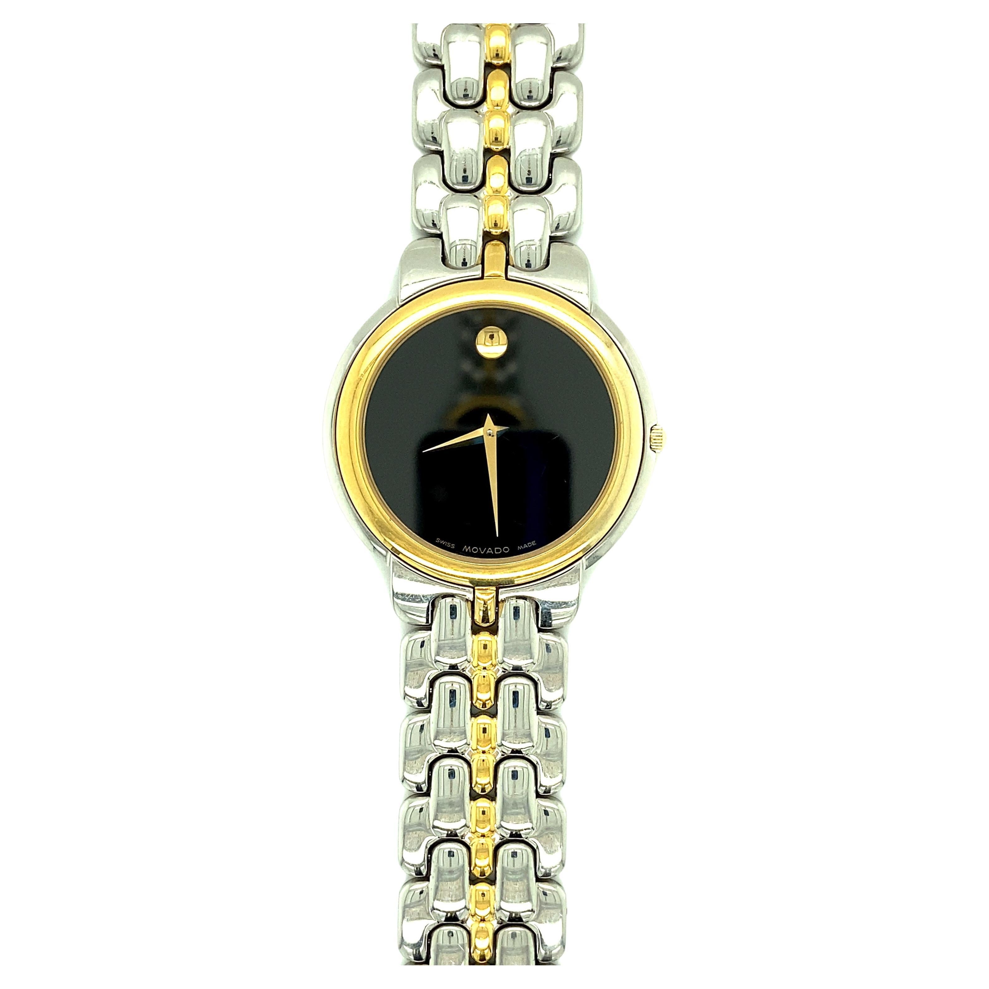 One Movado Swiss Quartz Museum black dial men's 35MM two-tone watch, 8I.A2.873.I  6715890, in stainless steel and gold plated stainless steel.

